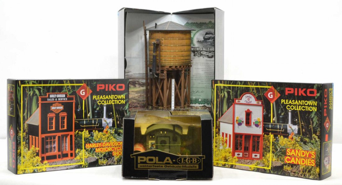 (4) GROUP OF PIKO, POLA, AND LGB TRAIN BUILDINGS: (lot of 4) Group of Piko, Pola, and LGB model train buildings and accessories, in original boxes, comprising: (1) 62212 Piko, Sandy's Candies; (1) 62211 Piko, Harley-Davidson motorcycle shop; (1) Pola