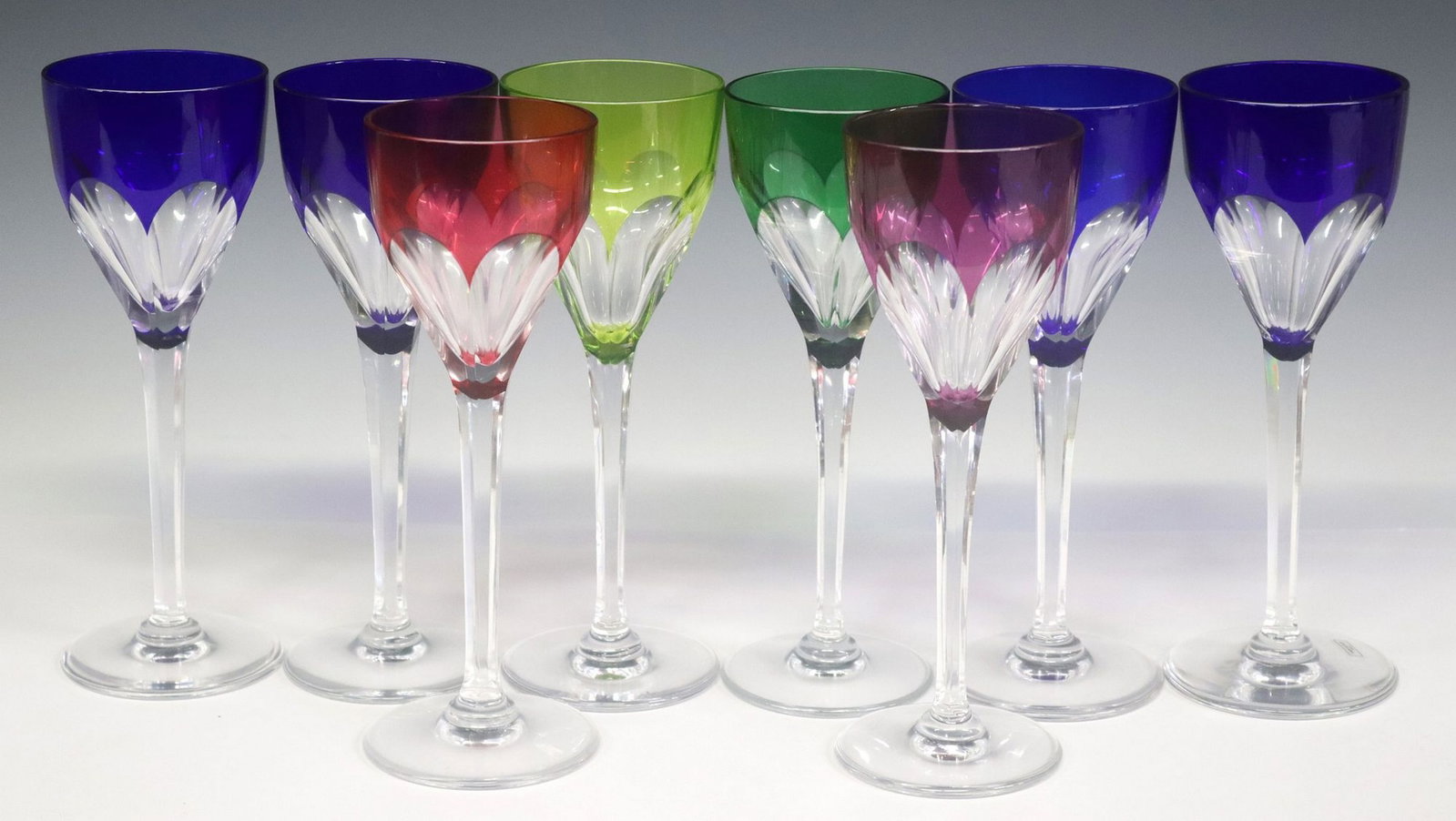 (8) ST. LOUIS 'BRISTOL' CUT CRYSTAL COLORED HOCK WINE STEMS: (lot of 8) St. Louis cut crystal colored hock wine stems, in the "Bristol" pattern, approx 8.5"h, 3"diam, 5.7lbs total *Provenance: From the estate of Carl Carter (Texas, 1955