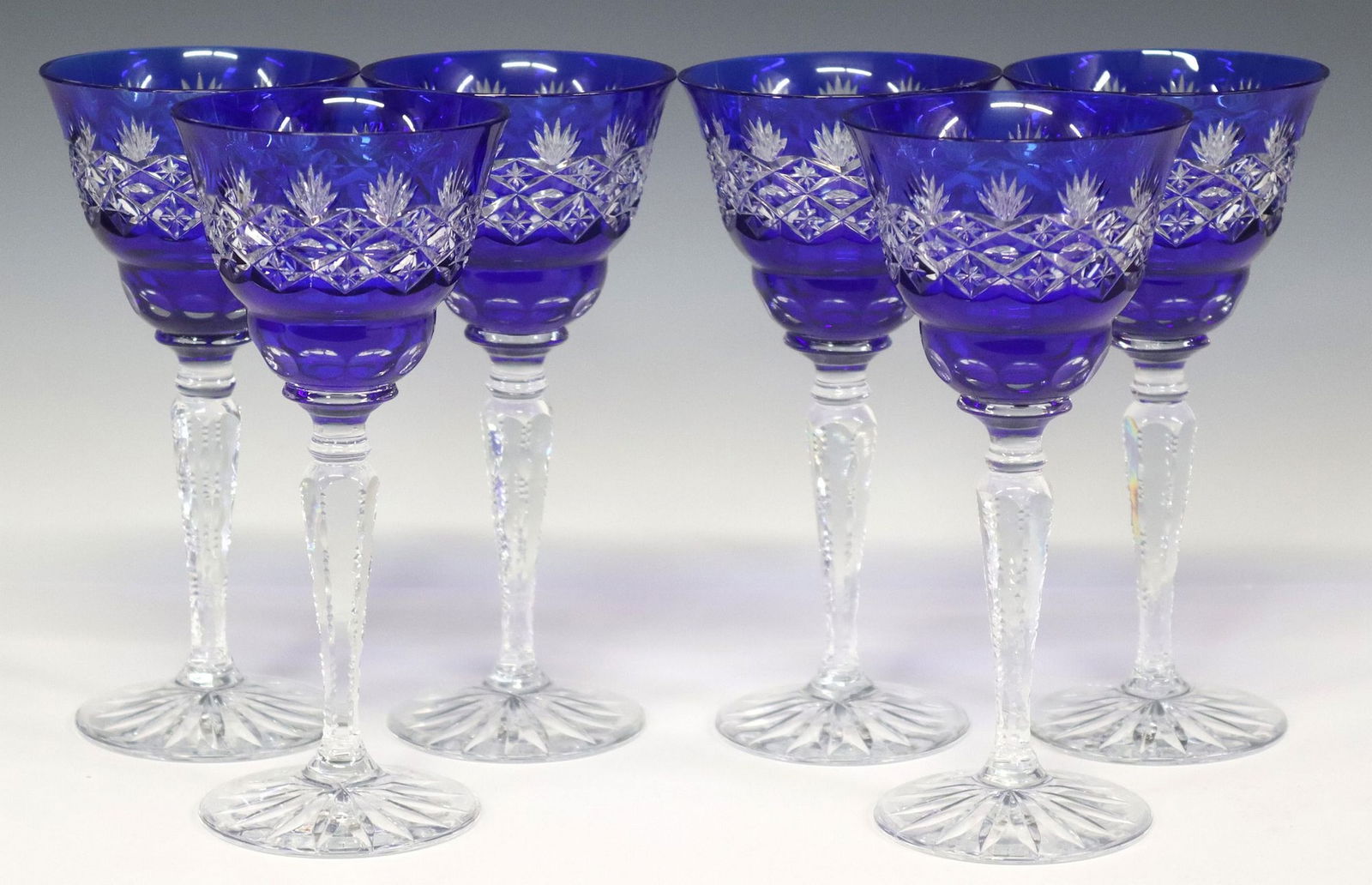 (6) CUT TO CLEAR CRYSTAL COBALT BLUE GOBLETS: (lot of 6) Cut to clear crystal cobalt blue wine stems, with stars and cross hatching, approx 7.75"h, 3 5/8"diam, 4.8lbs total **Provenance: From the estate of Carl Carter (Texas, 1955-