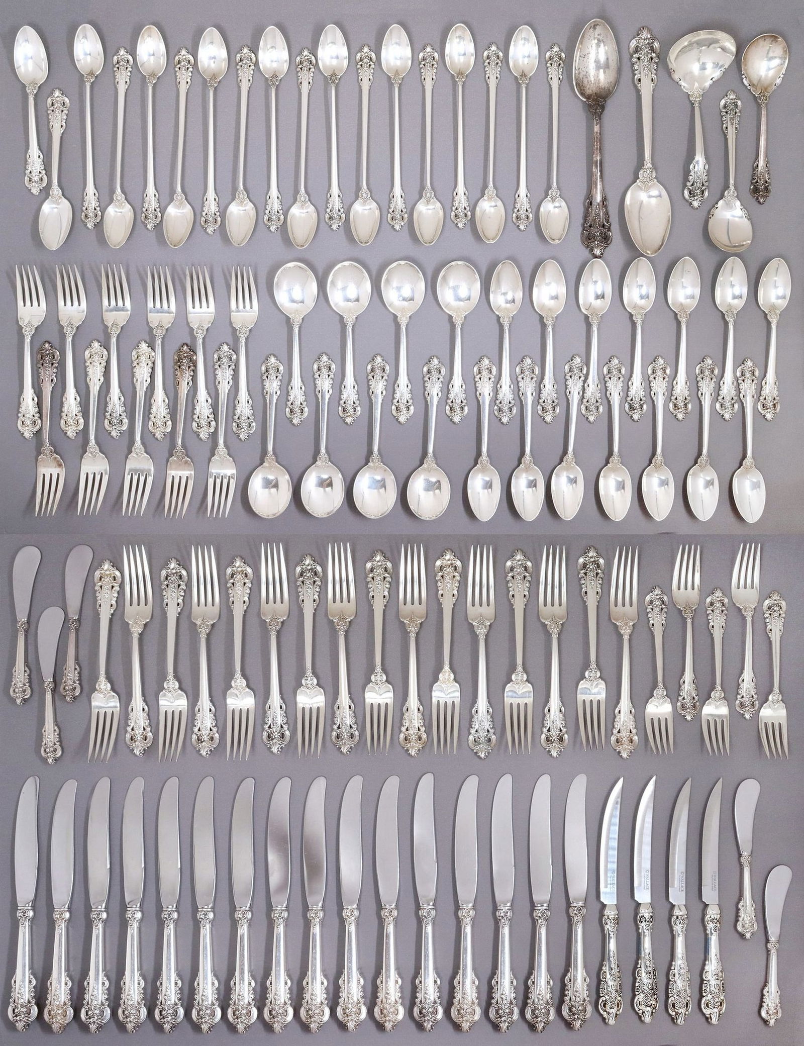 (102) WALLACE 'GRANDE BAROQUE' STERLING FLATWARE SERVICE: (lot of 102) American sterling silver flatware service, Wallace Silversmiths, in the "Grande Baroque" pattern, including: (16) hollow handle knives, 9.75"l, (5) hollow handle butter spr
