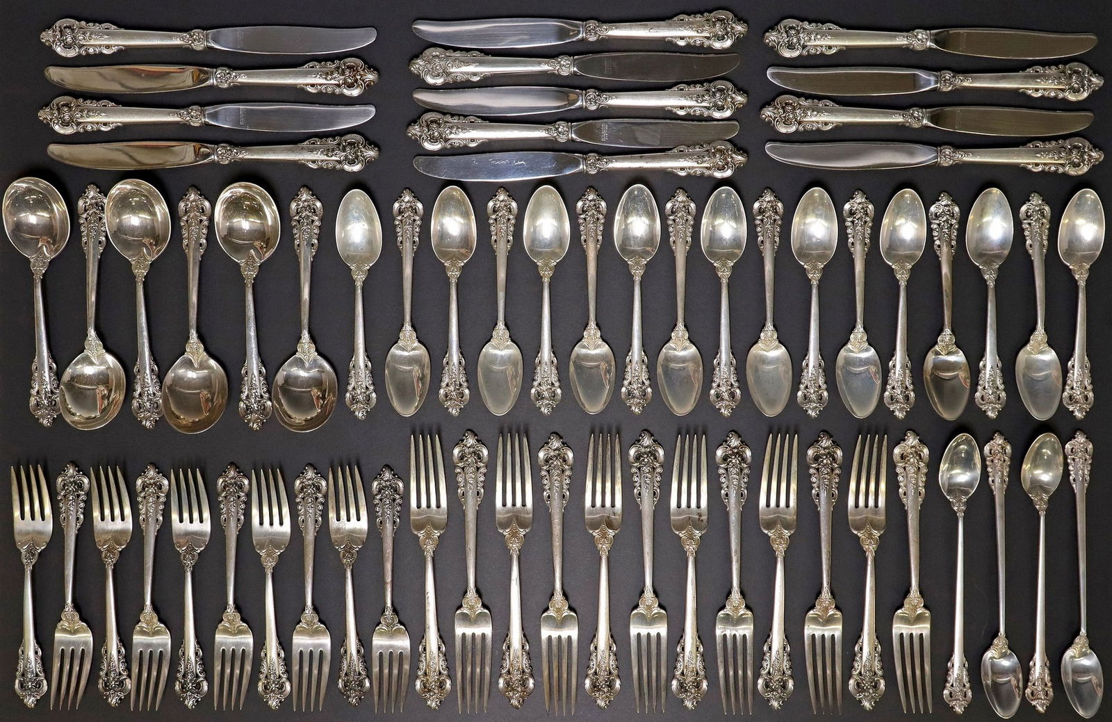 (74) WALLACE 'GRANDE BAROQUE' STERLING SILVER FLATWARE SERVICE: (set of 74) American sterling silver flatware service, Wallace Silversmiths, in the "Grande Baroque" pattern, including: (13) knives, 8 7/8"l; (12) butter spreaders, 6.25"l; (12) f