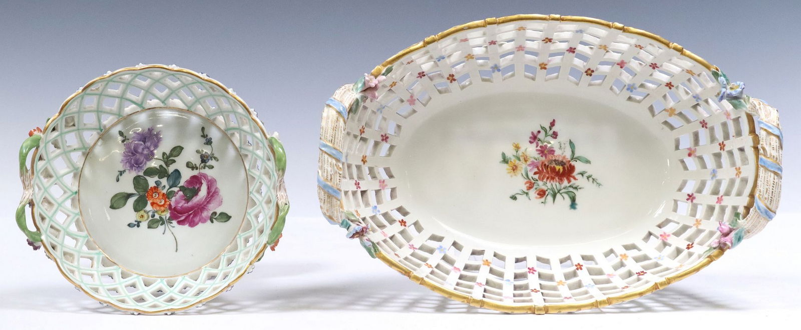 (2) BERLIN (K.P.M.) & SEVRES STYLE PORCELAIN PIERCED BASKETS: (lot of 2) Porcelain reticulated baskets, including: (1) Berlin porcelain basket, K.P.M. (Konigliche Porzellan-Manufaktur), dated 1911, painted to the interior with a bouquet of flowers, mol