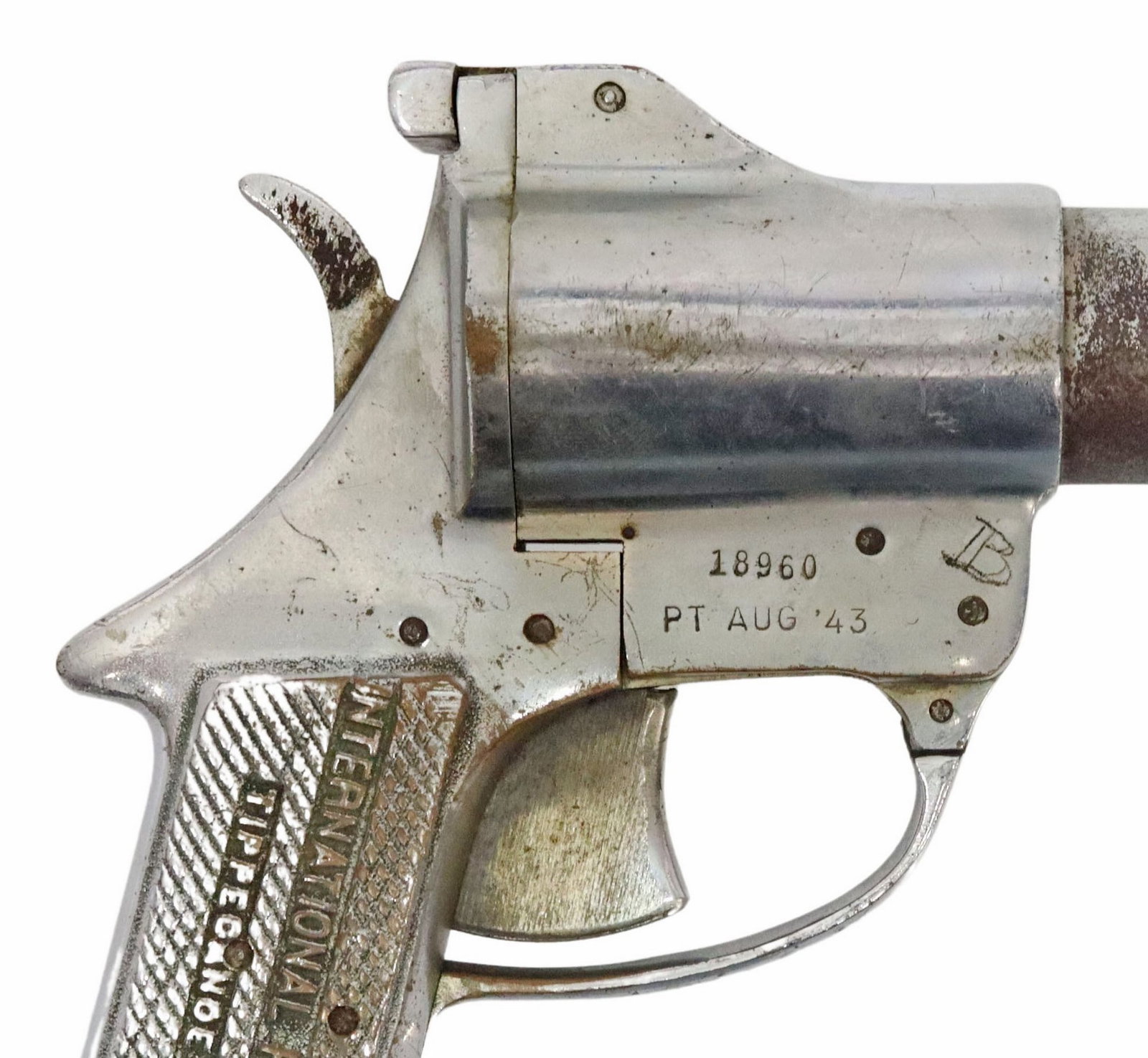 INTL FLARE SIGNAL GUN: Signal Pistol by International Flare Signal Co., Tippecanoe City, Ohio, markings include makers name at left grip, at right frame serial number "18960" over "Pt Aug '43", scrat