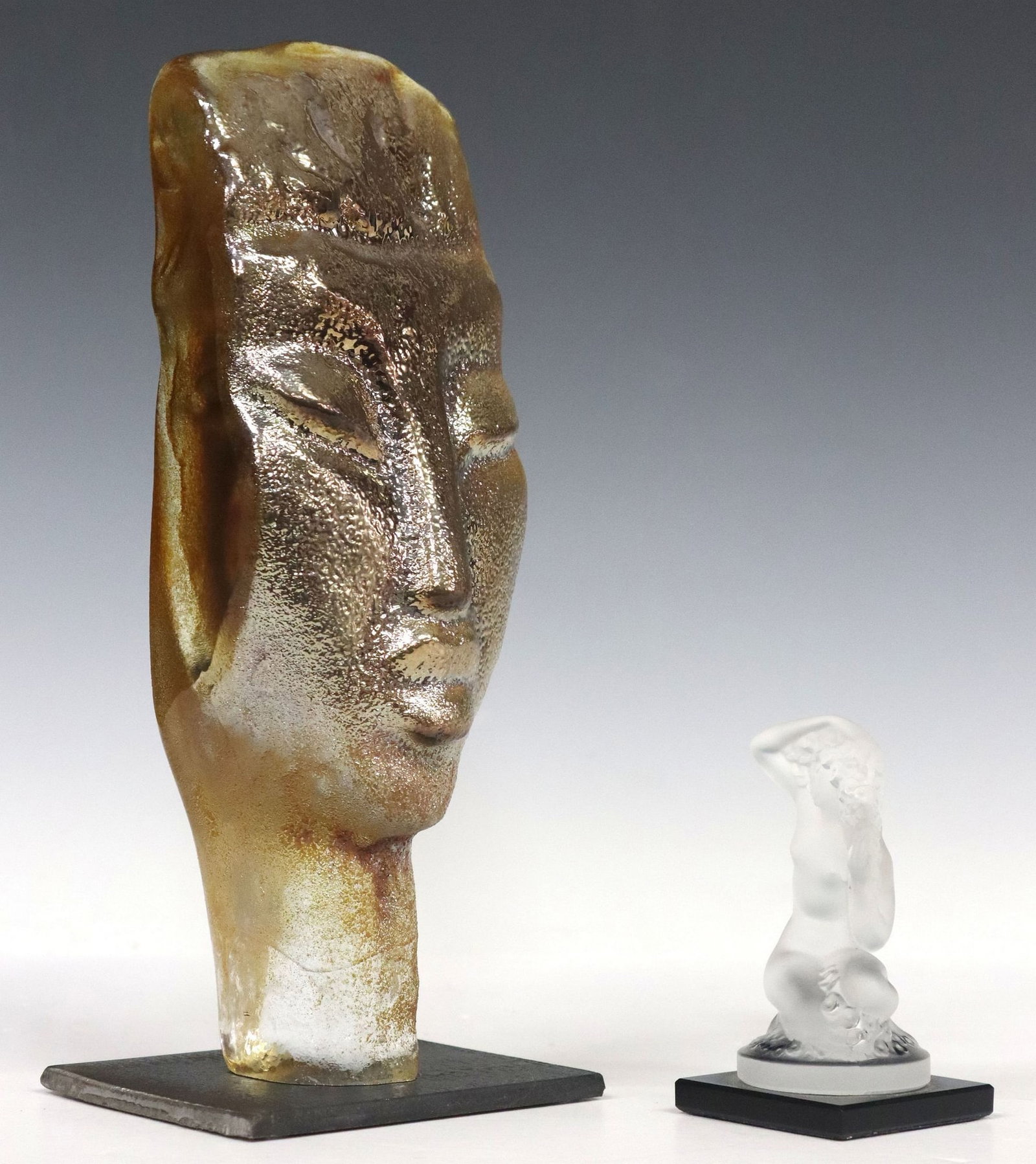 (2) BJORN EKEGREN (B.1955) & LALIQUE 'FLOREAL' GLASS SCULPTURES: (lot of 2) Glass sculptures, including: (1) sand cast glass sculpture, Face, signed Bjorn Ekegren (Swedish, b.1955), numbered 1/ 100, on a steel plinth, approx 9.5"h, 4"w, 3.25"d, 
