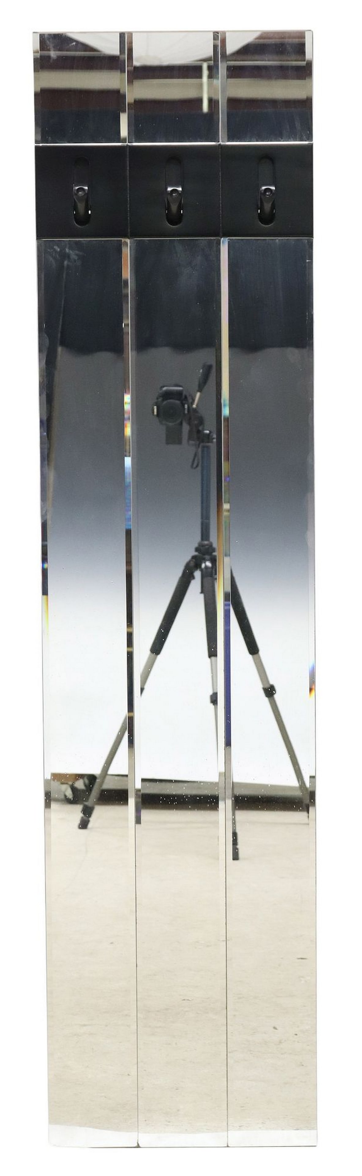 ITALIAN MODERN MIRRORED HALL TREE: Italian modern mirrored hall tree, c.1970s, having three beveled mirror plates, with three black drop hooks, approx 72.75"h, 17.75"w, 1"d