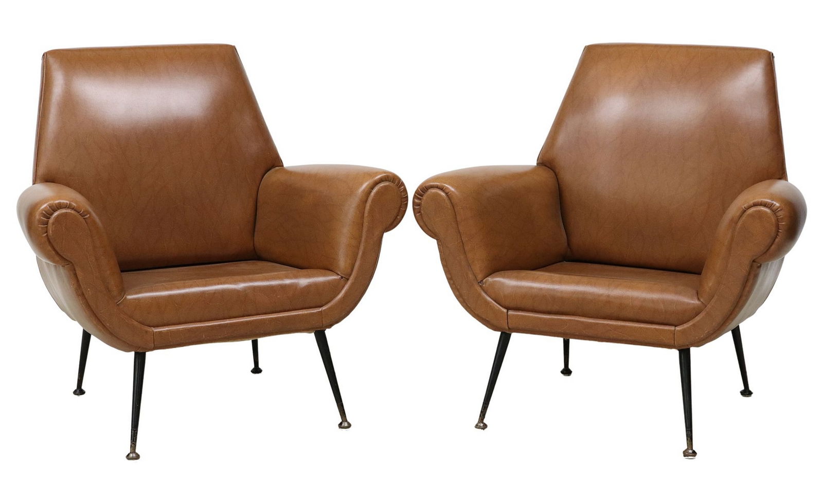 (2) ITALIAN MID-CENTURY MODERN UPHOLSTERED LOUNGE CHAIRS: (pair) Italian mid-century modern upholstered armchairs, in the manner of Gigi Radice (Italian, 1924-2002), c.1960s, each having rounded back and arms, in tan vinyl upholstery, rising on tapered metal
