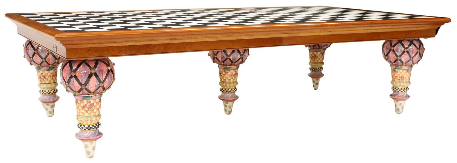 MONUMENTAL MACKENZIE-CHILDS 'TRAIN' CHECKERBOARD-TOP DINING TABLE, 9'6" L X 5' W: Mackenzie-Childs "Train" dining table, 21st c., having rectangular black and white checkerboard vinyl top, with cherrywood border, rising on tapered turned-form ceramic legs, with hand-painted designs