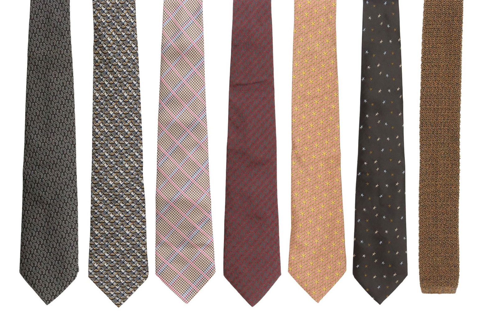 (7) HERMES SILK MENS NECK TIES VARIED PATTERNS: (lot of 7) Hermes silk mens neck ties, in varied patterns, colors, and sizes, including designs: (2) 758708T; (1) 7873 UA; (1) 7864 UA; (1) knitted blue and gold; (1) pink, blue, brown, and white ging