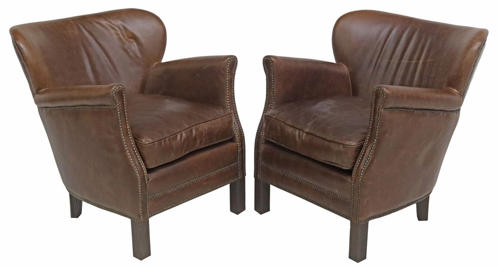 (2) RESTORATION HARDWARE PROFESSOR'S LEATHER WING CHAIRS: (pair) Diminutive English-style brown leather wing chairs, Restoration Hardware, 21st c., rounded chair back, loose seat cushion, trimmed with nail-heads, on wood legs, some scuffs/ abrasions to 