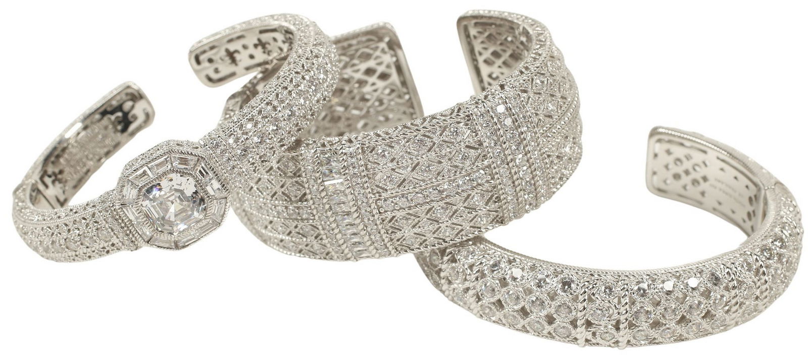 (3) JUDITH RIPKA STERLING SILVER & CUBIC ZIRCONIA HINGED CUFF BRACELETS: (lot of 3) Estate designer sterling silver hinged cuff 'cocktail' bracelets, Judith Ripka, set with cubic zirconia, pierced fleur-de-lis motifs to interior, hallma