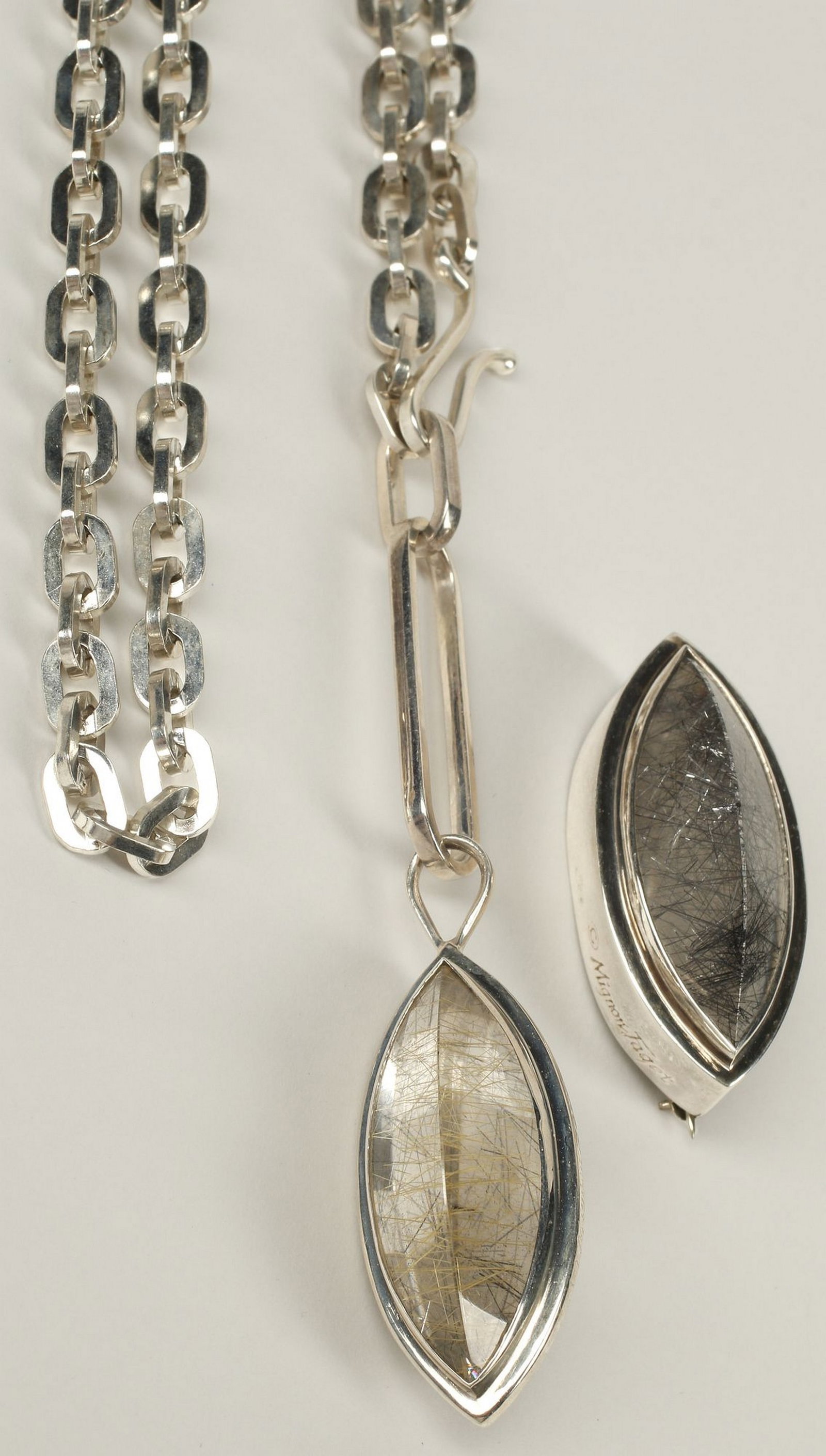 (2) ESTATE MIGNON FAGET (B.1933) STERLING SILVER PENDANT NECKLACE & BROOCH: (lot of 2) Estate designer sterling silver and rutilated quartz jewelry group, Mignon Faget (New Orleans, Louisiana, b.1933), each hallmarked sterling with maker's mark at side, including: (1) dou