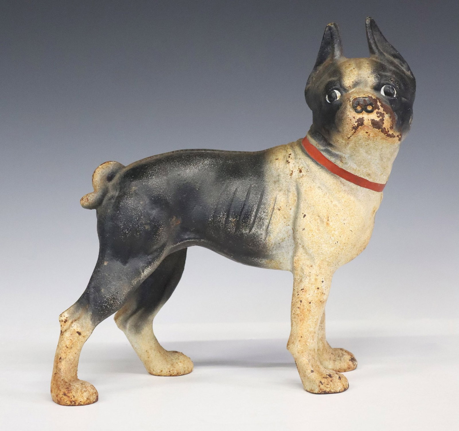PAINTED CAST IRON BOSTON TERRIER DOORSTOP: Painted cast iron doorstop, modeled as a Boston terrier, after Hubley Manufacturing Company, approx 9.75"h, 9.75"w, 4.5"d, 8lbs **Provenance: A luxury home in Westlake Hills, 