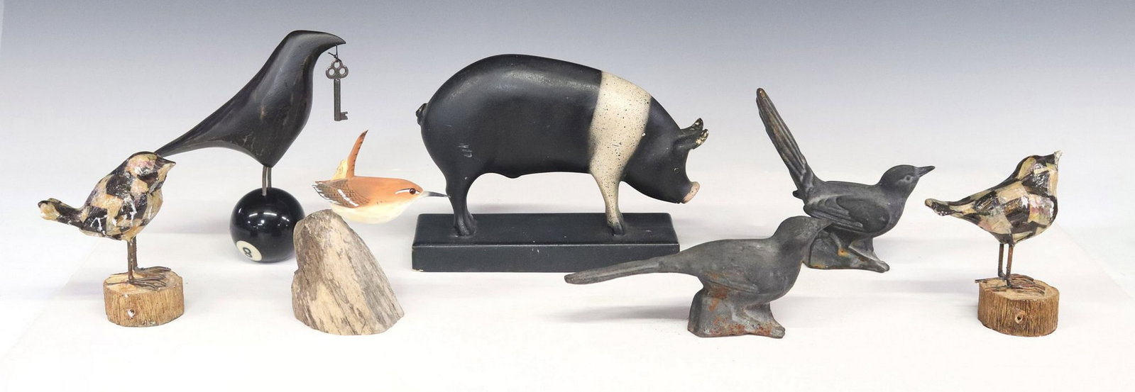 (7) COLLECTION OF CARVED ANIMAL SCULPTURES: BIRDS & PIG: (lot of 7) Collection of birds and pig sculpture, including: (1) carved wood raven perched on magic eight ball, attributed to Mark Orr (American, 1956-2018) for Scavenger Art series, attached met
