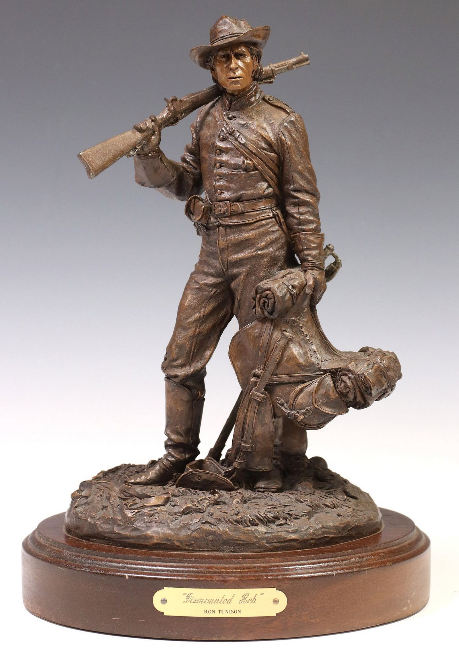 RON TUNISON (D.2013) COLD CAST RESIN BRONZE SCULPTURE, 'DISMOUNTED REB': Cold cast resin bronze sculpture, "Dismounted Reb," signed in cast Ron Tunison (Ronald F. Tunison, American, 1946-2013), dated [19]90, numbered 169/ 350, on integral wood base with title pla