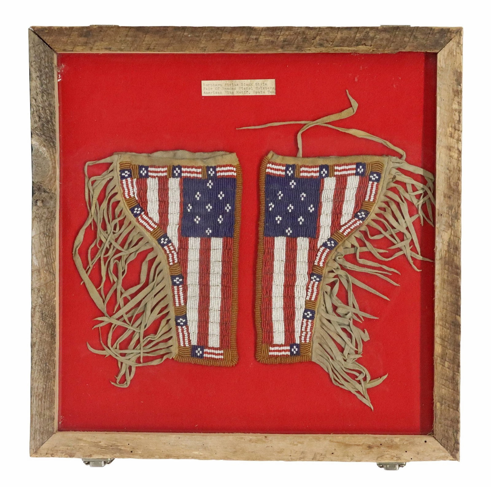 (PAIR) FRAMED NATIVE AMERICAN STYLE BEADED LEATHER HOLSTERS: (pair) Native American style beaded leather holsters, 20th/ 21st c., each with the American flag sewn vertically onto the leather holster with fringe, a legend reading "Northern Plains,