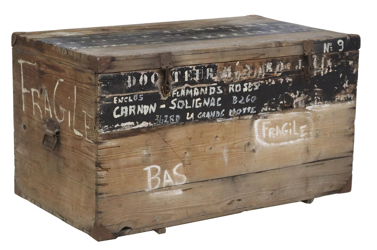 RUSTIC FRENCH COLONIAL PAINT-DECORATED COFFER STORAGE CHEST: Rustic French colonial paint decorated coffer/ storage chest, early 20th c., having hinged top with patinated iron corner mounts, dual carrying handles, open interior, with painted lettering at top an