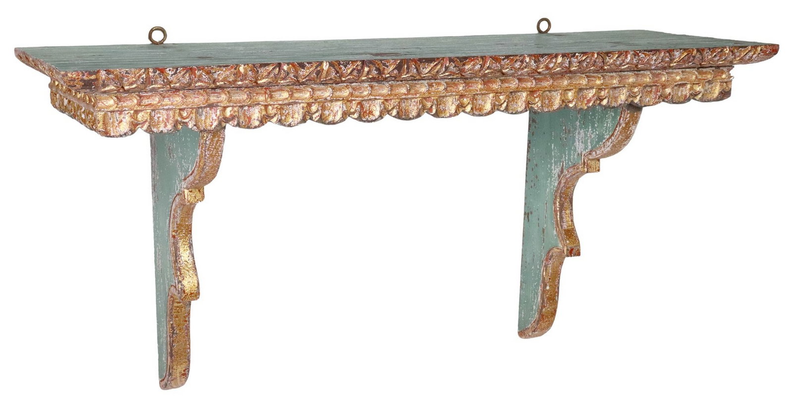 SPANISH COLONIAL-STYLE PAINTED & PARCEL-GILT WALL SHELF: Spanish Colonial-style carved wood wall shelf, design attributed to Marcia Bland Brown, San Miguel de Allende, Mexico, 20th c., parcel-gilt and green-painted finish, rectangular shelf with carved edge