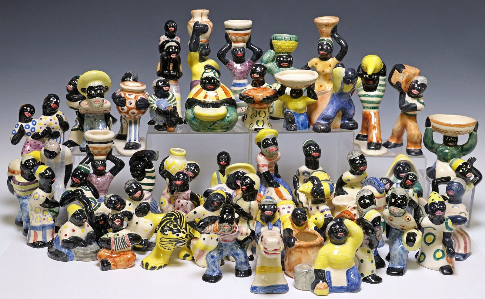 (47) COLLECTION OF SHEARWATER POTTERY CERAMIC FIGURES: (lot of 47) Collection of figural ceramic figures, Shearwater Pottery (Ocean Springs, Mississippi), figures in various pursuits and poses, highlights include: (2) women with both hands on basket on he