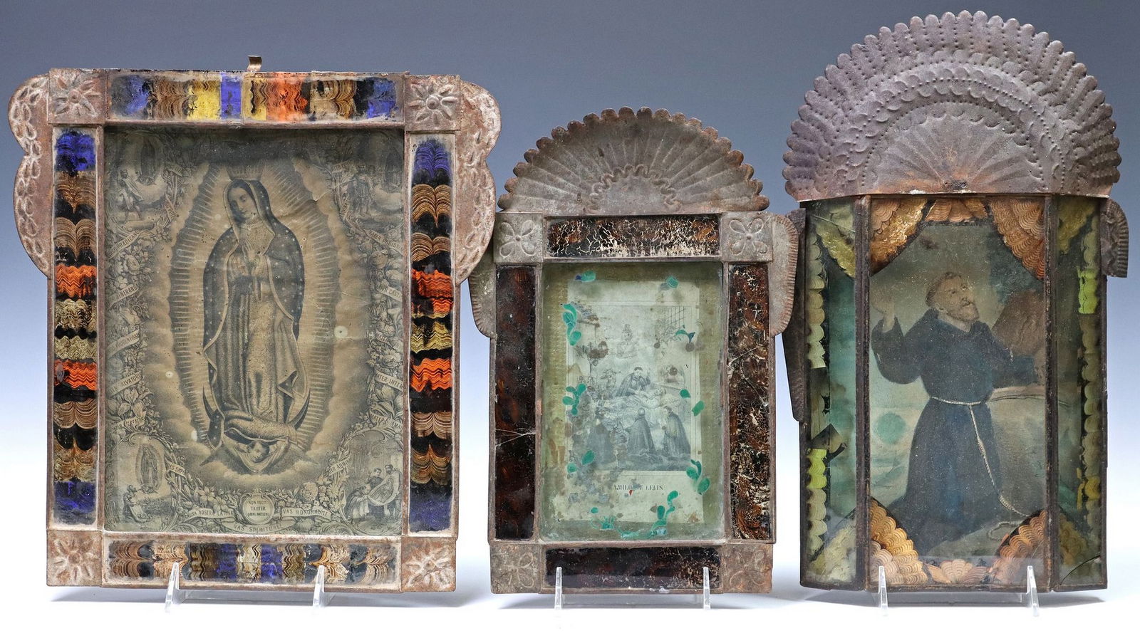 (3) SHADOWBOX FRAMED RELIGIOUS RETABLO PRINTS, MEXICO: (lot of 3) Framed retablo prints, Mexico, each housed in an embossed metal shadowbox nicho/ frame, including: (1) La Virgen de Guadalupe (Our Lady of Guadalupe), (1) San Francisco de Asis (Saint