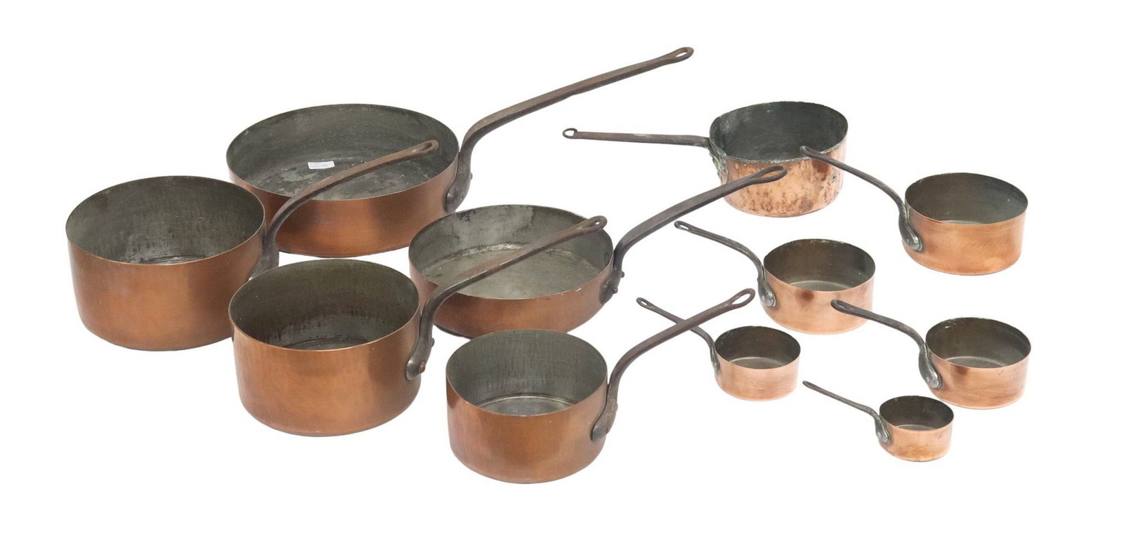 (12) FRENCH COPPER & IRON GRADUATED SAUCEPANS: (lot of 12) French copper saucepans, comprised of two sets, each unmarked and with iron side handle, including: (5) graduated saucepans, largest: approx 9.5"h, 26"w, 12.75"d; 