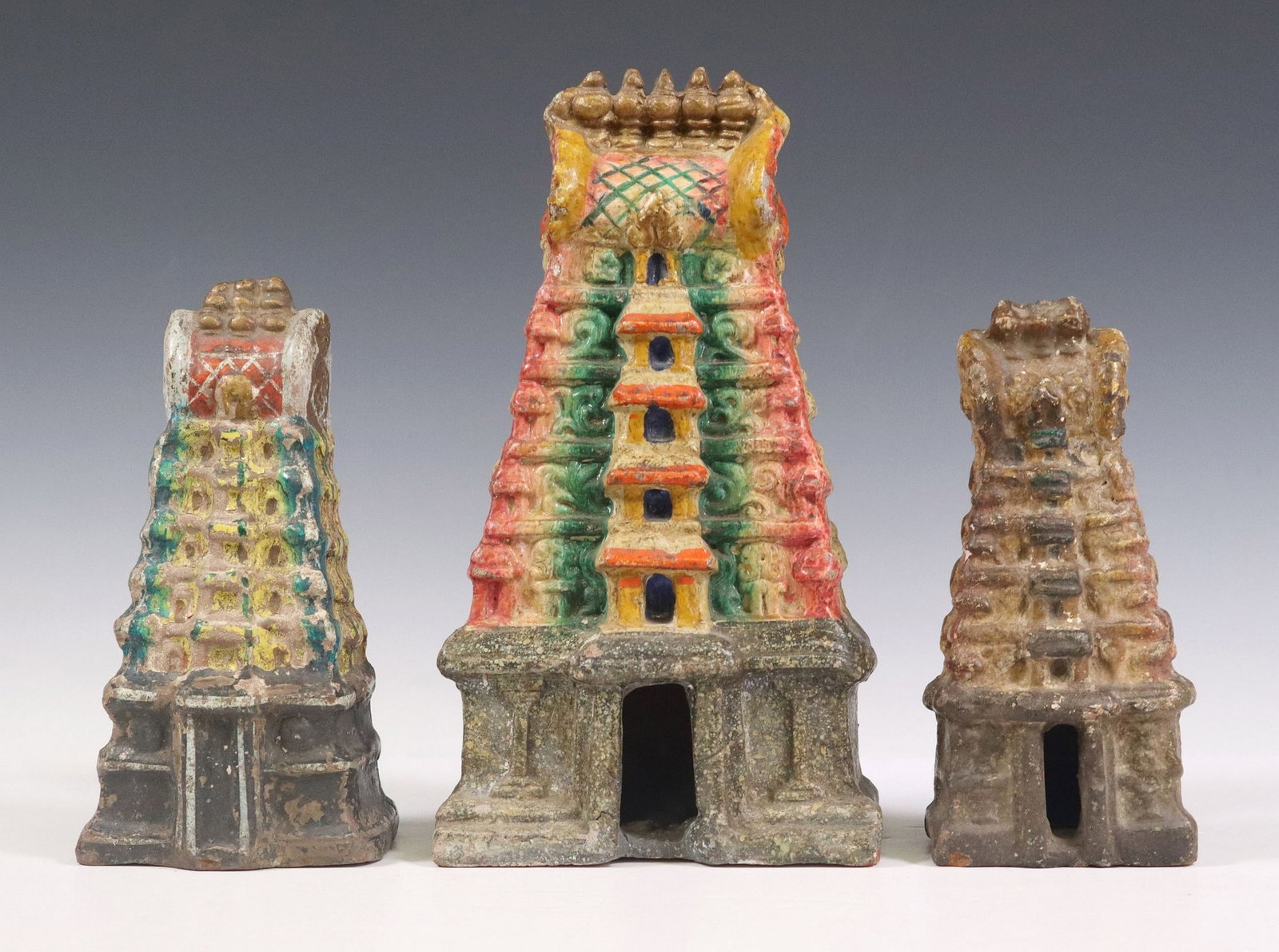 (3) POLYCHROME TERRACOTTA MODELS OF HINDU TEMPLES, INDIA: (lot of 3) Polychrome terracotta models of Hindu temples, India, various sizes, two with hollow interior, largest: approx 10.75"h, 5 7/8"w, 3.5"d 5.7lbs total