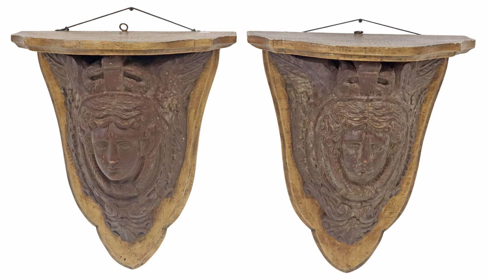 (2) ARCHITECTURAL CARVED WOOD MASK WALL BRACKETS: (pair) French architectural carved wood corbels/ wall brackets, early 20th c., having shaped top, over central mask flanked by twisting snake motif, among scrolled foliates, floral medallions and ange