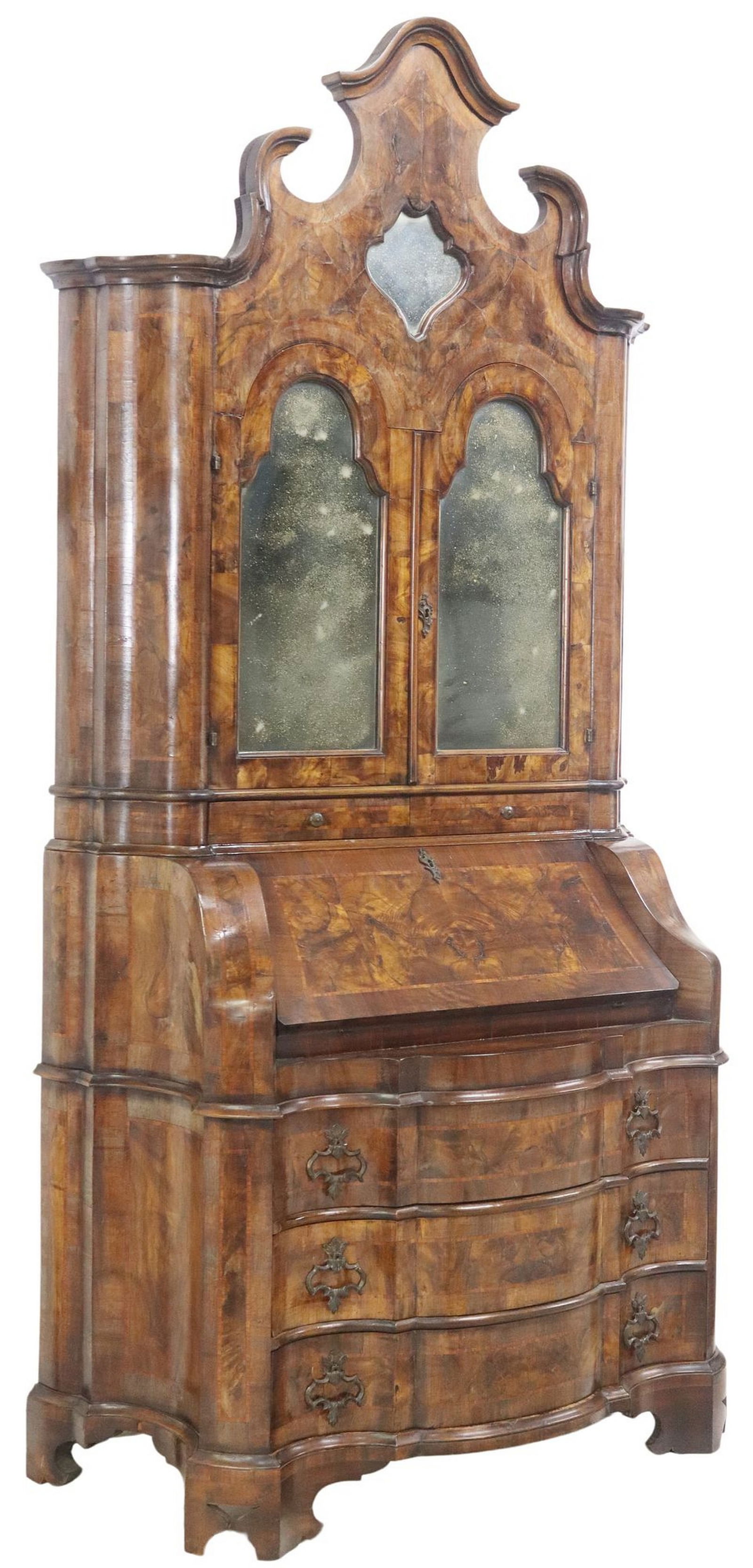 VENETIAN MIRRORED SECRETARY BOOKCASE: Venetian secretary bookcase, 20th c., split pediment, two doors faced with antiqued mirror plates, opening to fabric-lined shelves, two frieze drawers, over the hinged slant-front writing surface, fit