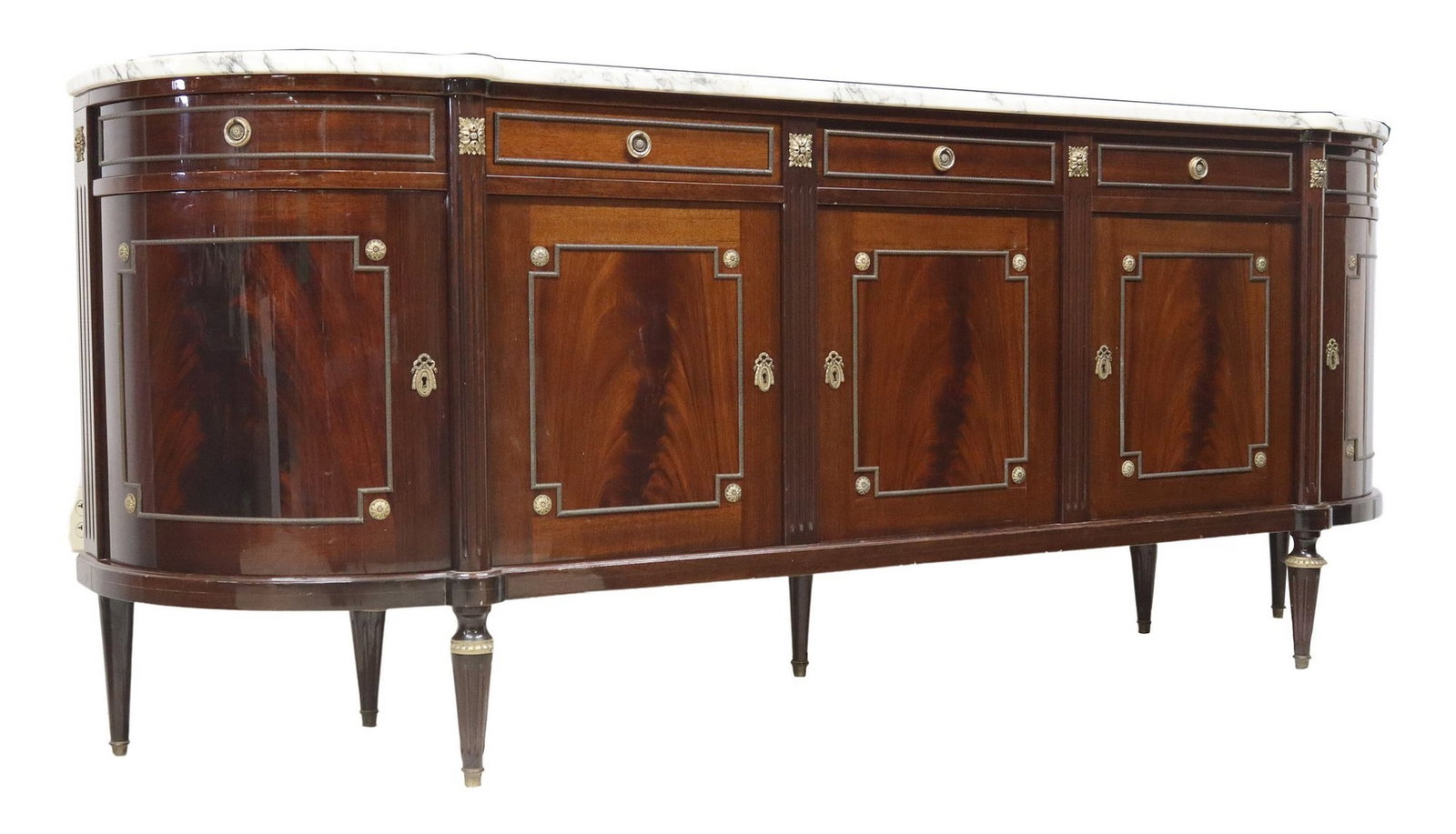 FRENCH LOUIS XVI STYLE MARBLE-TOP MAHOGANY SIDEBOARD: French Louis XVI style mahogany sideboard, 20th c., having shaped marble top, over demilune case fitted with four felt-lined drawers, and three cabinet doors, each with one shelf, flanked by single ro