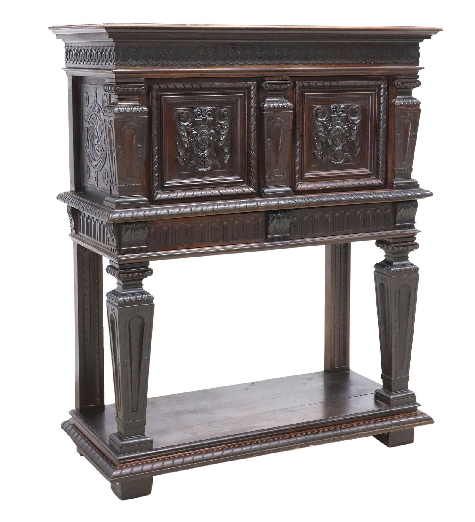 FRENCH RENAISSANCE REVIVAL CARVED WALNUT CABINET ON STAND: French Renaissance Revival walnut cabinet on stand, late 19th c., having molded cornice, frieze with running ornamentation, two cabinet doors carved with masks, over two drawers, rising on tapered squ