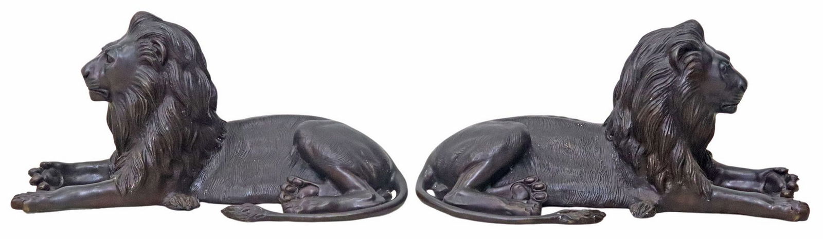 (2) SIGNED A. TIOT PATINATED BRONZE SCULPTURES, RECUMBENT LIONS: (lot of 2) Patinated bronze sculptures, Recumbent Lions, signed in cast A. Tiot (20th c.), each resting with opposite paw turned outward, approx 13"h, 27"w, 12"d, 65lbs total 