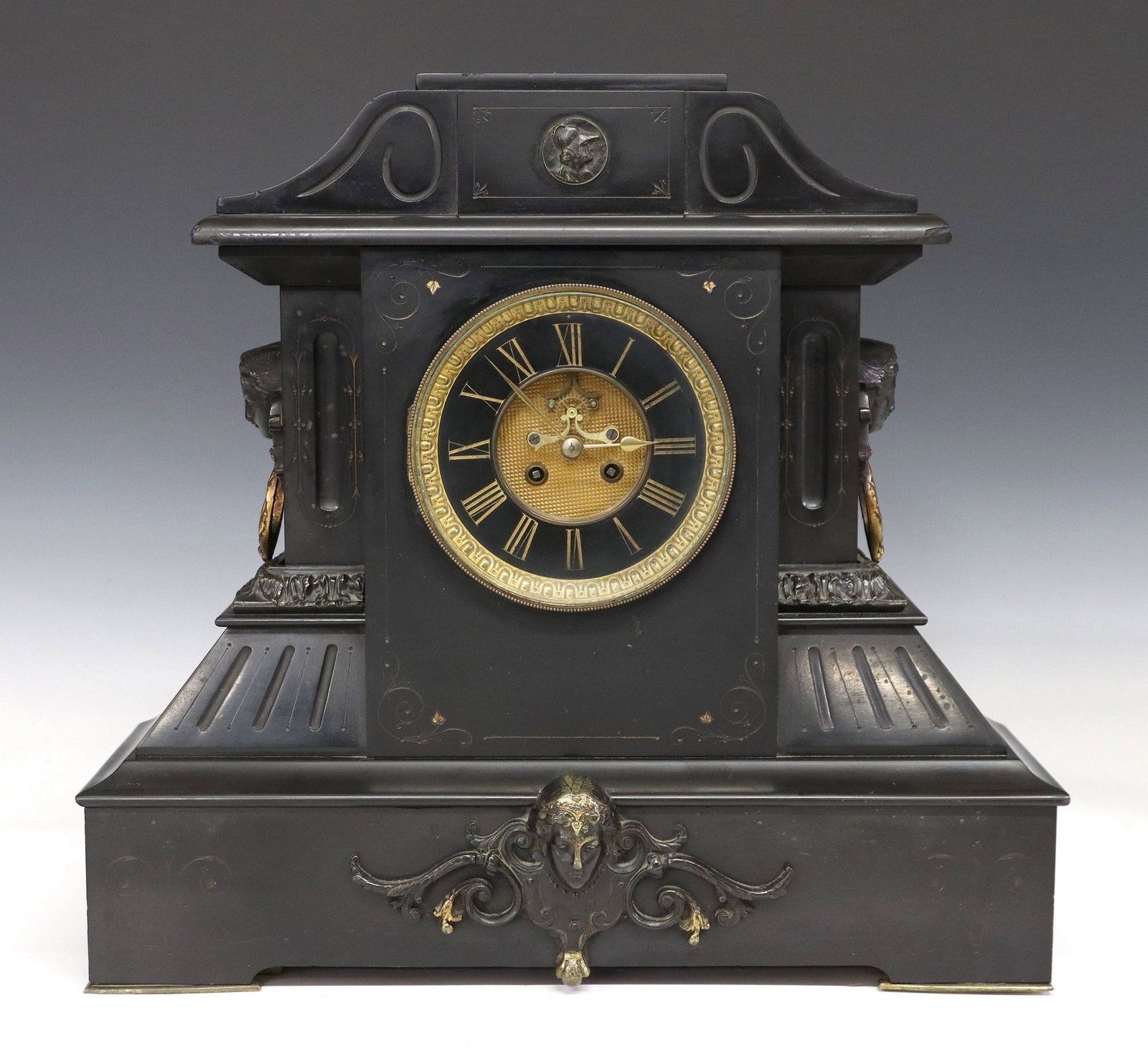 LARGE FRENCH SLATE MANTEL CLOCK WITH BROCOT ESCAPEMENT: French mantel clock, 19th c., architectural slate case with incised decoration, chapter ring with gilt Roman numeral hours, Brocot escapement, time-and-strike movement marked Marti et Cie, lacking pen