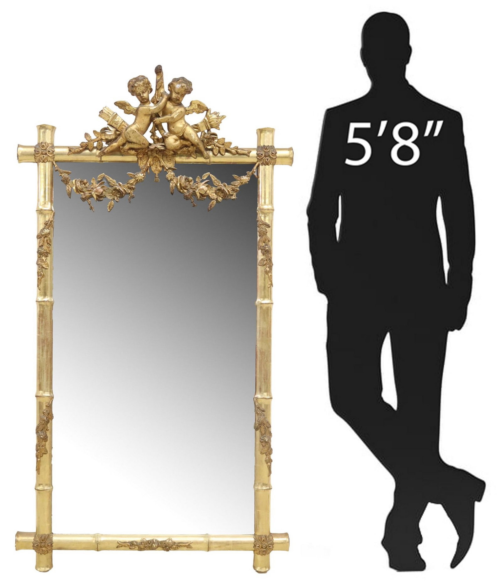 LARGE FRENCH GILTWOOD FAUX BAMBOO & CHERUBS MIRROR, 63" X 34.5": Large French giltwood wall mirror, late 19th c., having figural crest depicting two winged cupids, afront crossed torch and quiver of arrows, draped floral swag, above turned faux bamboo frame, encasi