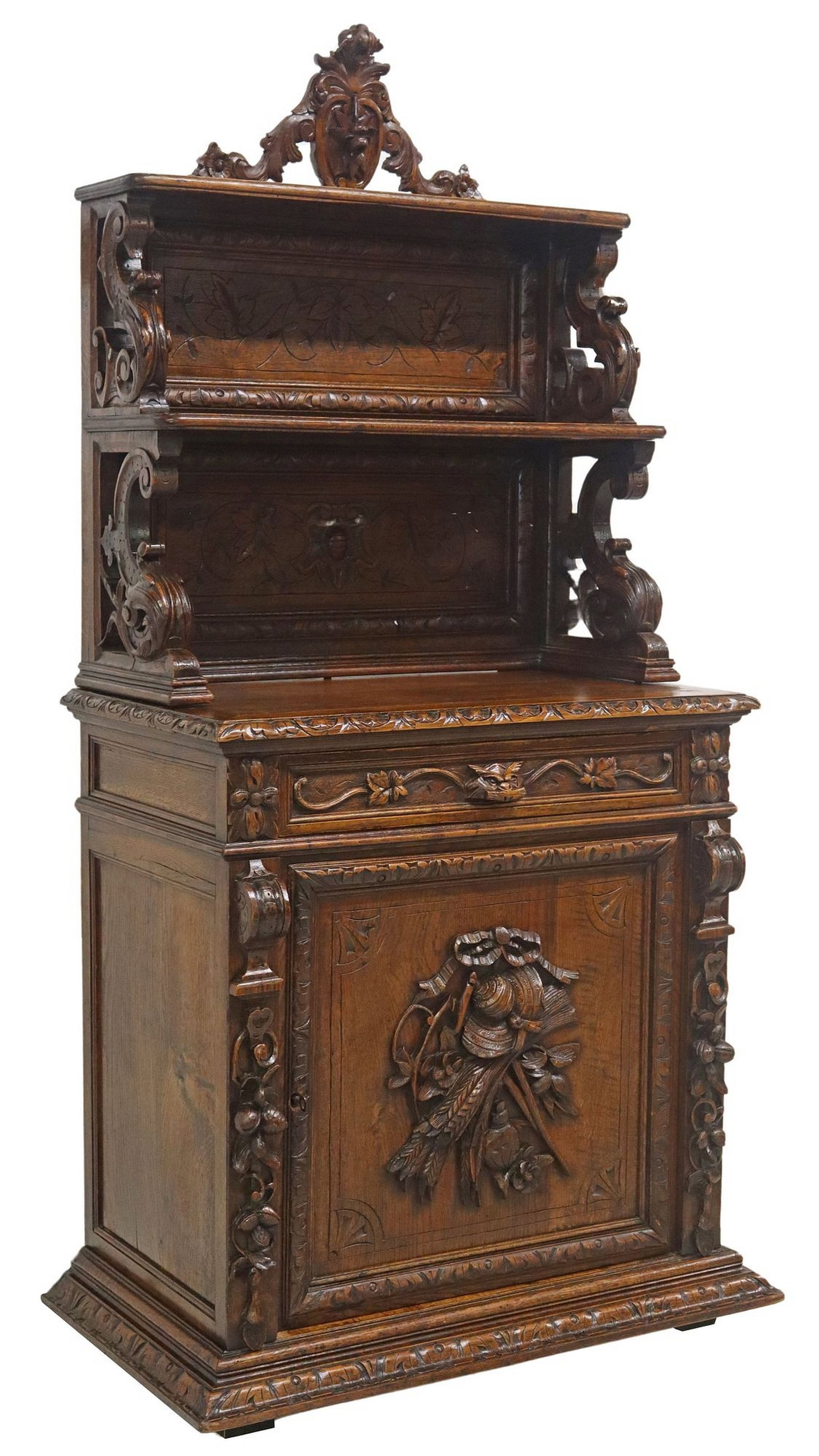 RENAISSANCE REVIVAL CARVED OAK HARVEST MOTIFS BUFFET/ SERVER: French Renaissance Revival carved oak buffet/ server, late 19th c., having pierced crest, over two open shelves with incised foliate motifs, rising on scrolled supports, lower case fitted with si