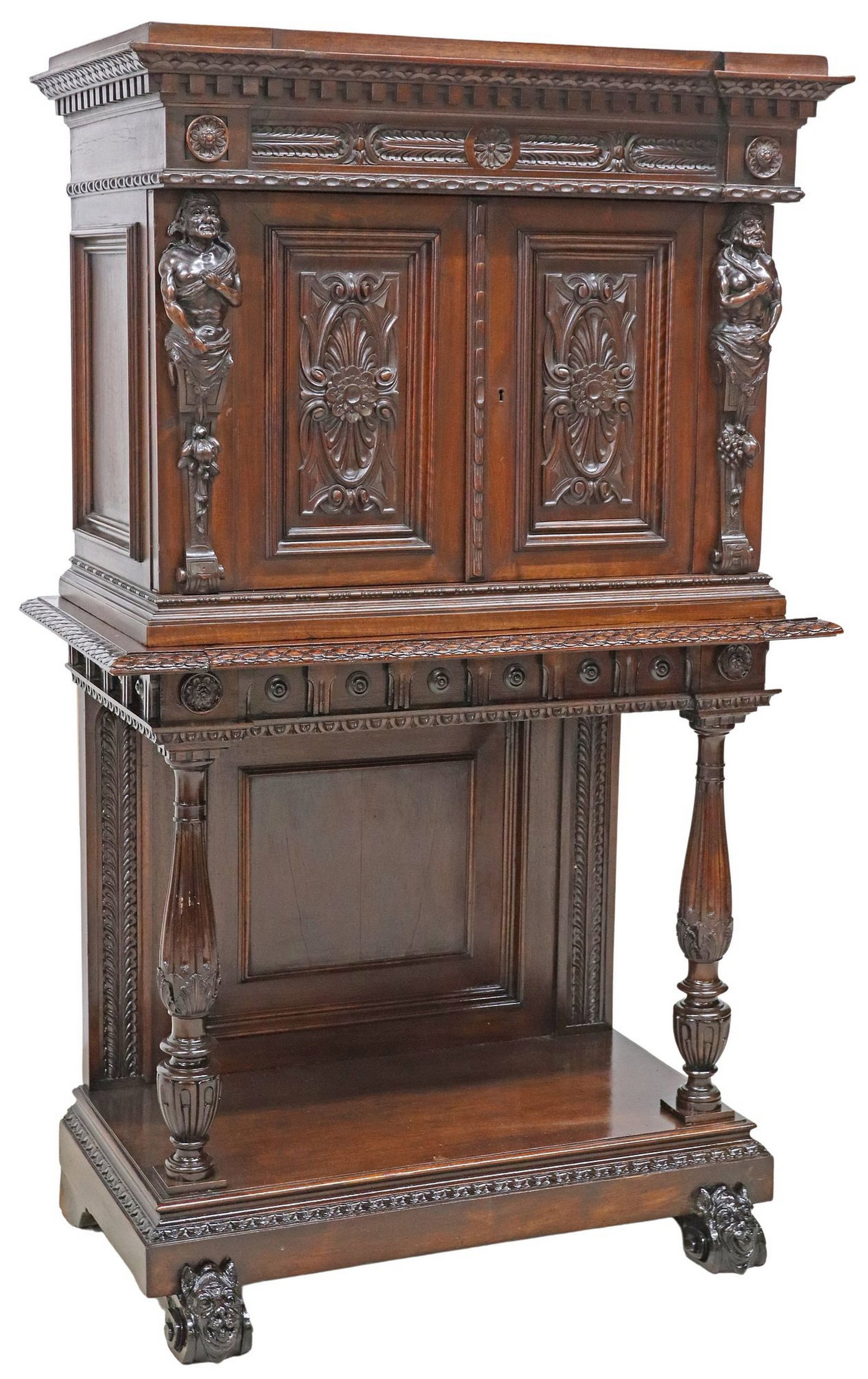 RENAISSANCE REVIVAL FLORAL & FIGURAL CARVED CABINET: Renaissance Revival carved cabinet, 19th c., having shaped top with running ornamentation trim, over two cabinet doors, revealing drawered interior, flanked by figural male columns, scrolled flor