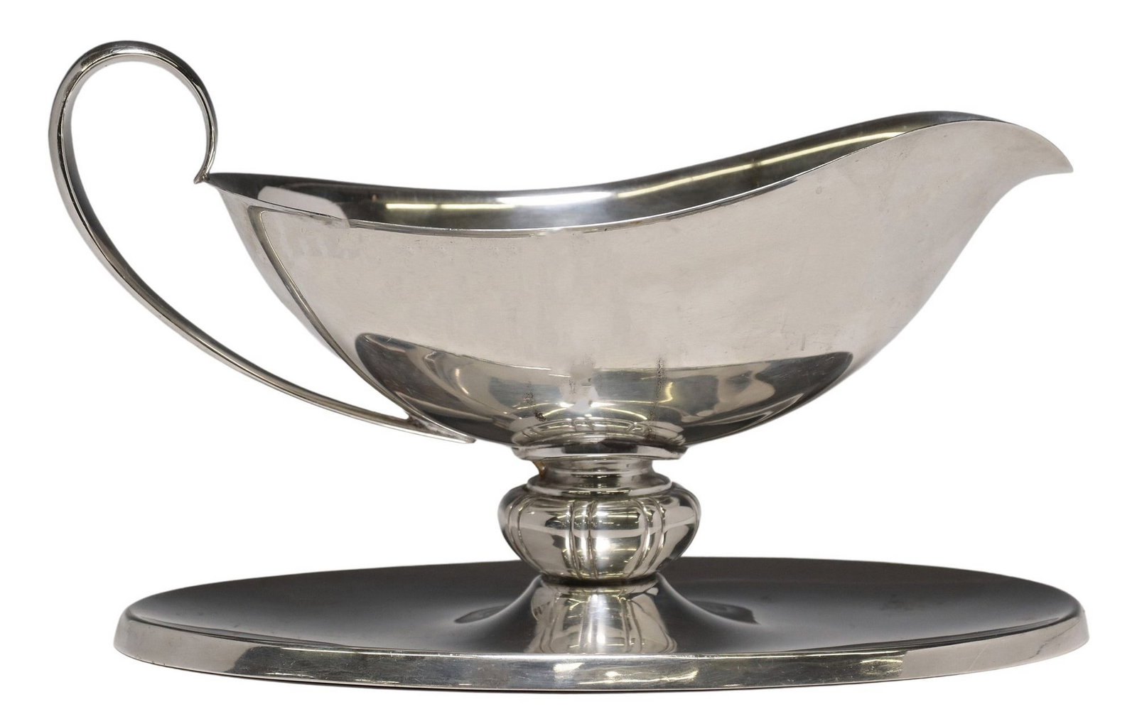 REED & BARTON STERLING SILVER GRAVY BOAT ON STAND: American sterling silver gravy or sauce boat with attached underplate, Reed & Barton, c.1950, scroll handle, fluted knop stem, hallmark includes model no. X242 and date symbol, approx 5.5"h, 