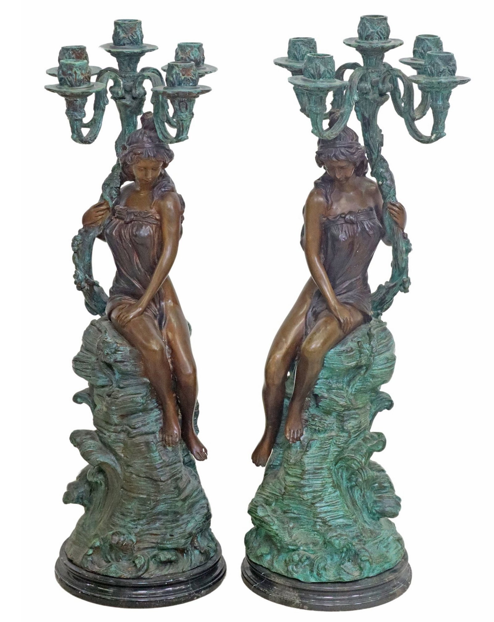 (2) PATINATED BRONZE FIGURAL FEMALE BEAUTIES 5-LT CANDELABRA: (lot of 2) Patinated bronze figural five-light candelabra, each in a Verde and brown patina, having five scrolled arms with foliate molded candle cups, rising on standard modeled as a female figure se