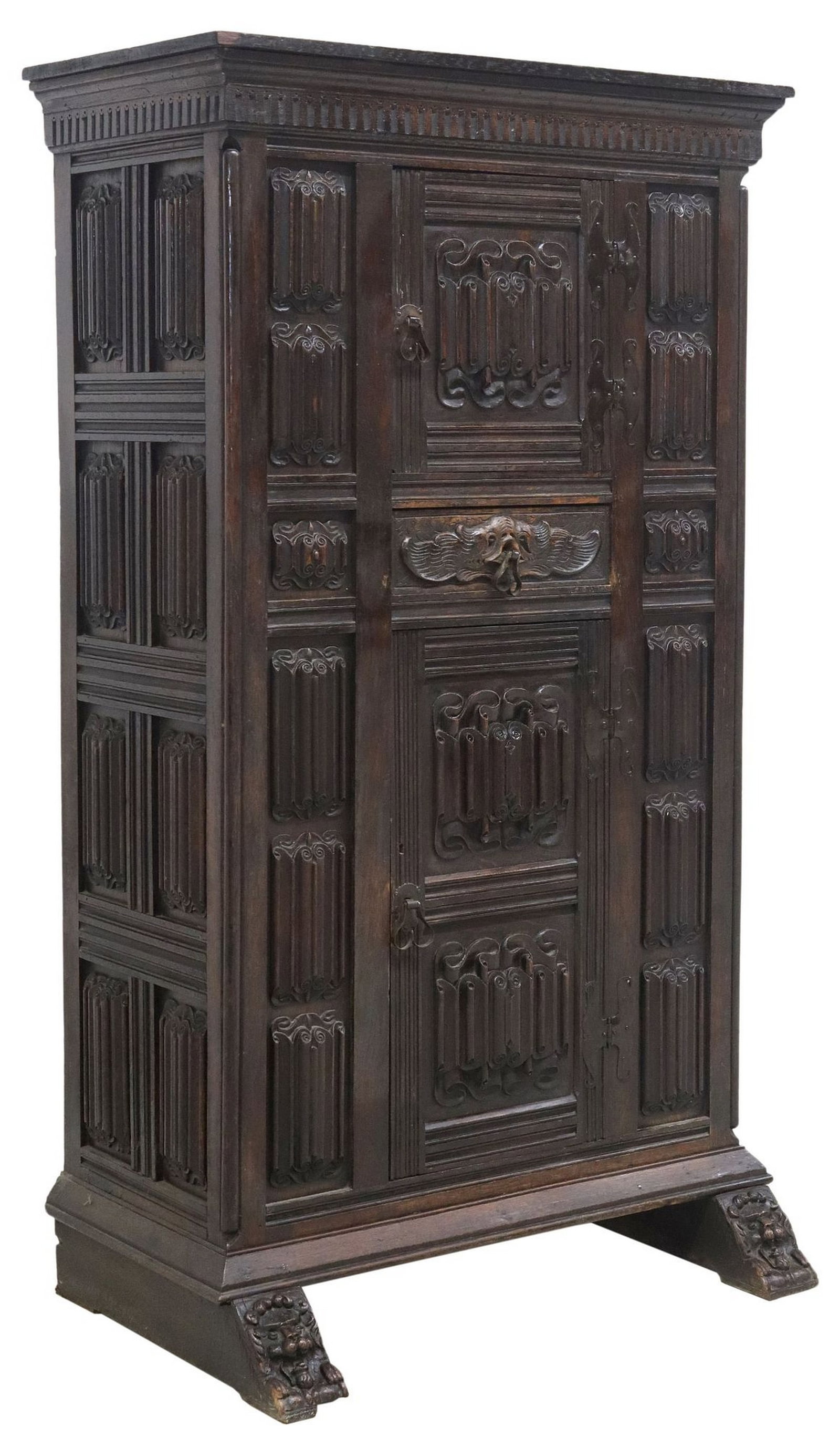 ENGLISH GOTHIC REVIVAL CARVED OAK CUPBOARD: English Gothic Revival carved oak cupboard, late 19th c., having top cornice, over linenfold paneling, central mini top cabinet door, one drawer, and one lower cabinet door, revealing s