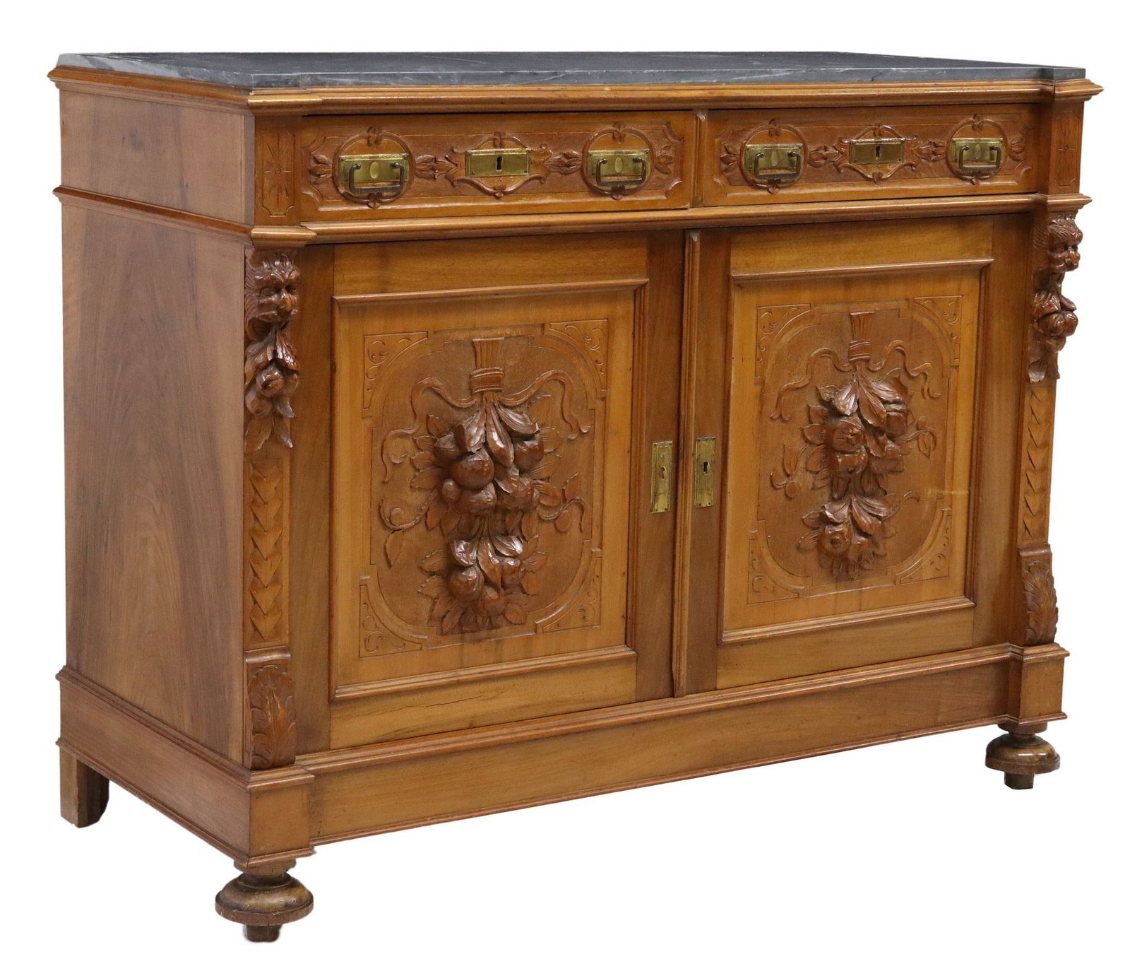 ITALIAN RENAISSANCE REVIVAL MARBLE-TOP CARVED SIDEBOARD: Italian Renaissance Revival carved sideboard, 19th c., having marble-top, over two drawers and two cabinet doors, gilt metal pulls, flanked by grotesque masks, carved fruit pendants, ending on shaped 