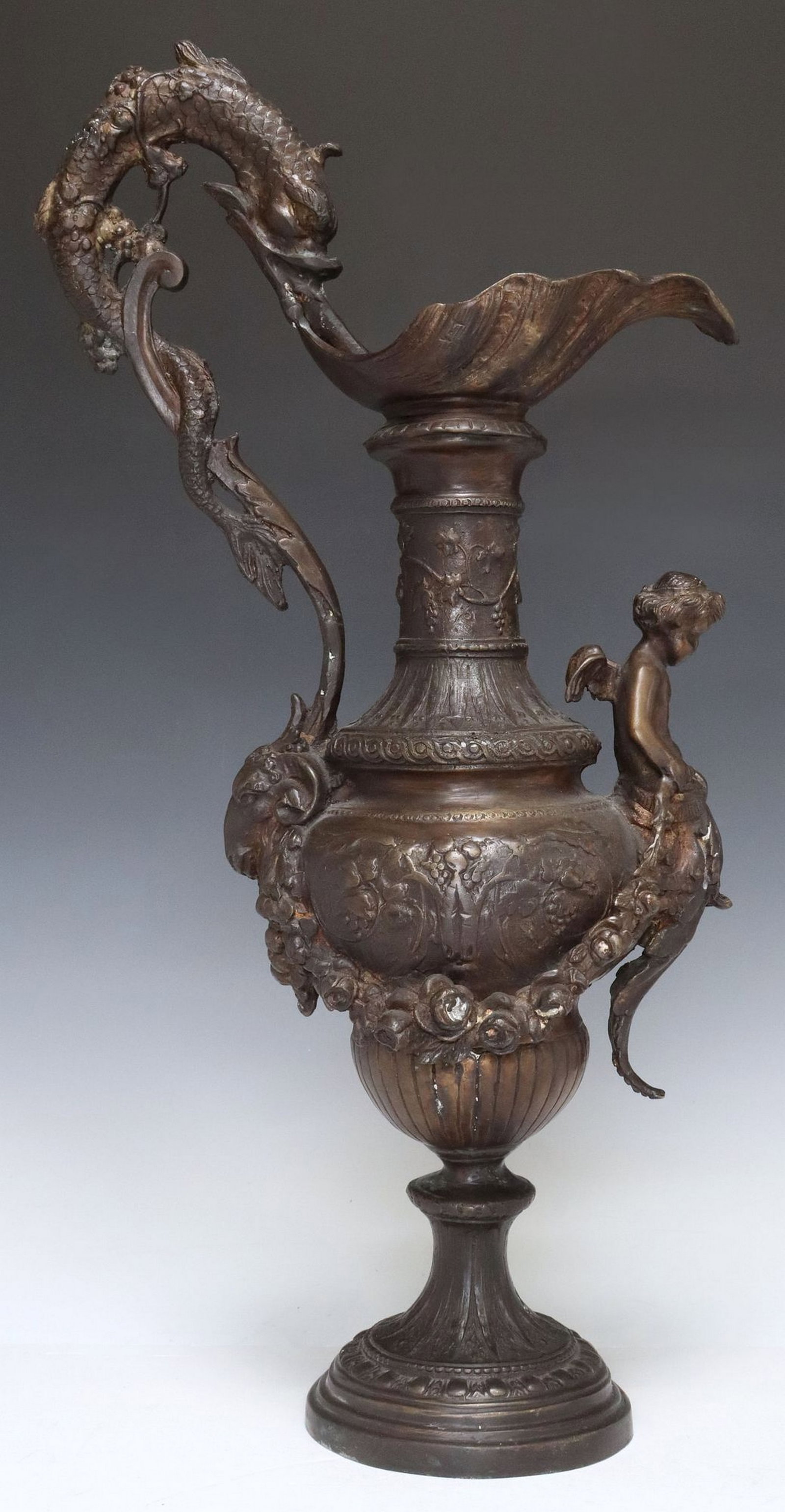 LARGE RENAISSANCE STYLE PATINATED BRONZE EWER: Renaissance style patinated bronze ewer, with dolphin-form handle, approx 23.25"h, 18.25lbs