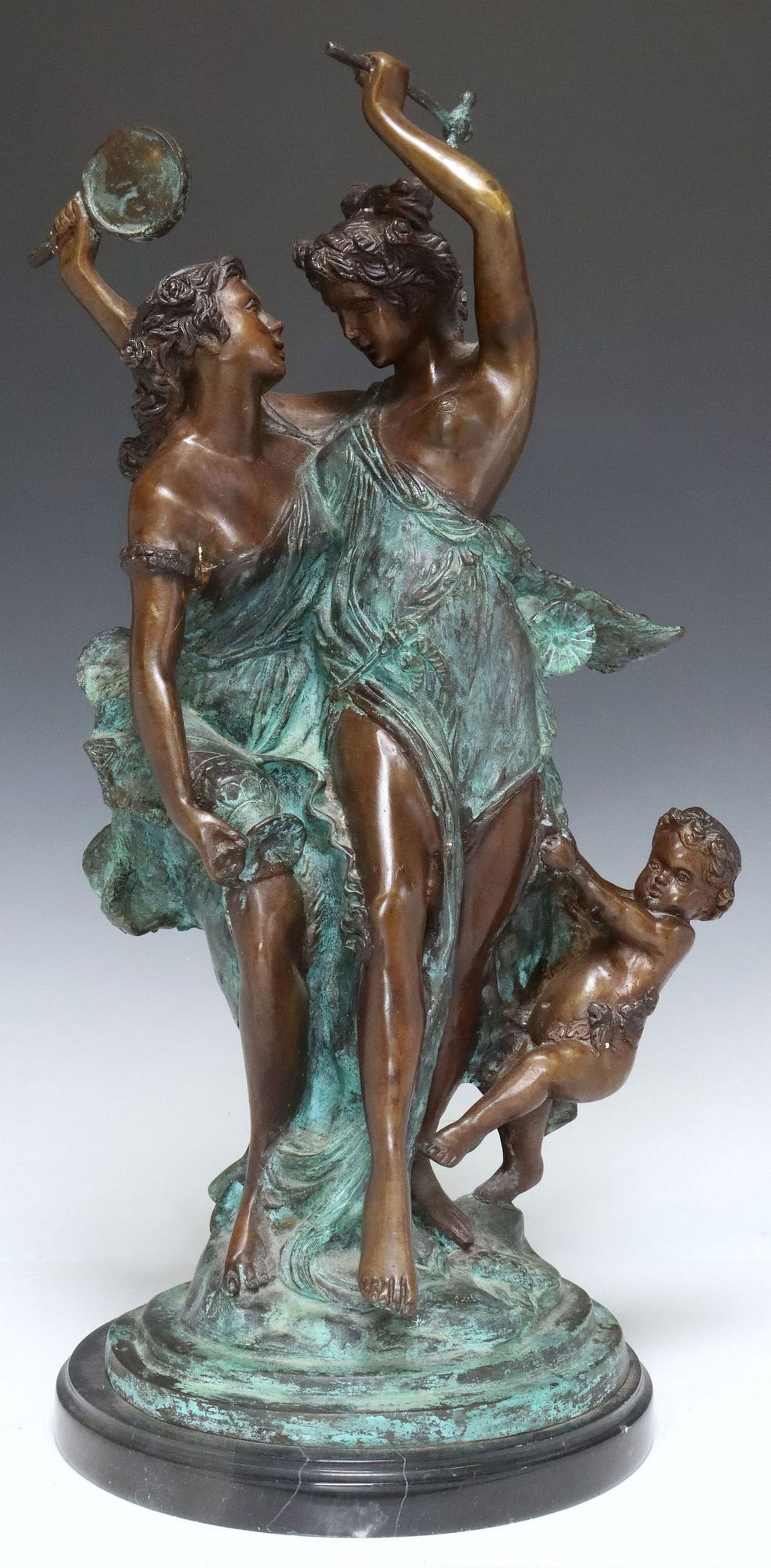 PATINATED BRONZE SCULPTURE BACCHANALIA: Patinated bronze sculpture, Bacchantes with Putto, signed in the cast after Auguste Moreau, on a black marble base, overall: approx 21.25"h, 9"diam, 27.25lbs 