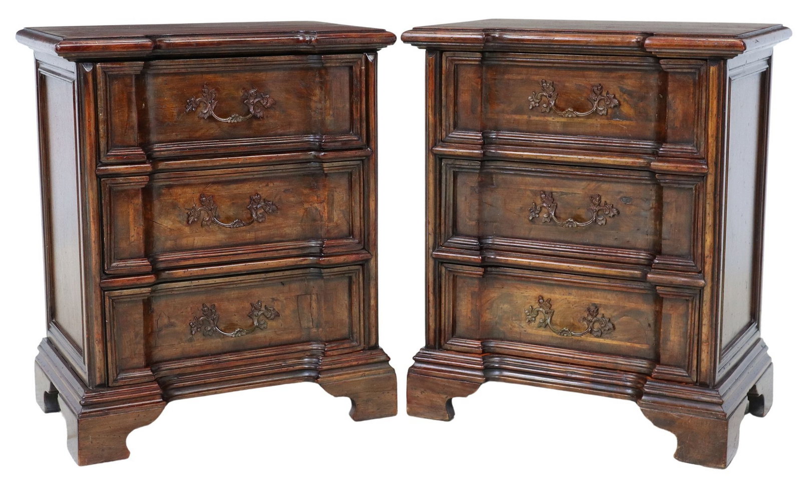 (2) ITALIAN BAROQUE STYLE THREE-DRAWER NIGHTSTANDS: (pair) Italian Baroque style nightstands, early 20th c., each having shaped top, above conforming case fitted with three drawers, rising on bracket, approx 27.5"h, 23"w, 14"d