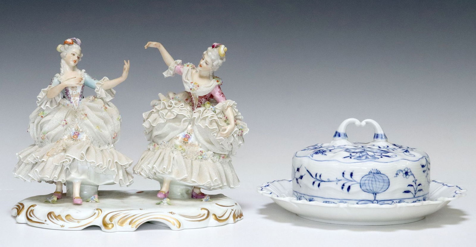 (2) MEISSEN 'BLUE ONION' PORCELAIN BUTTER DISH & DRESDEN LACE FIGURE GROUP: (lot of 2) German porcelain, including: (1) Meissen "Blue Onion" round butter dish with cover, underplate with ruffled edge, blue crossed swords mark, approx 3.75"h, 8.25"diam, (1)