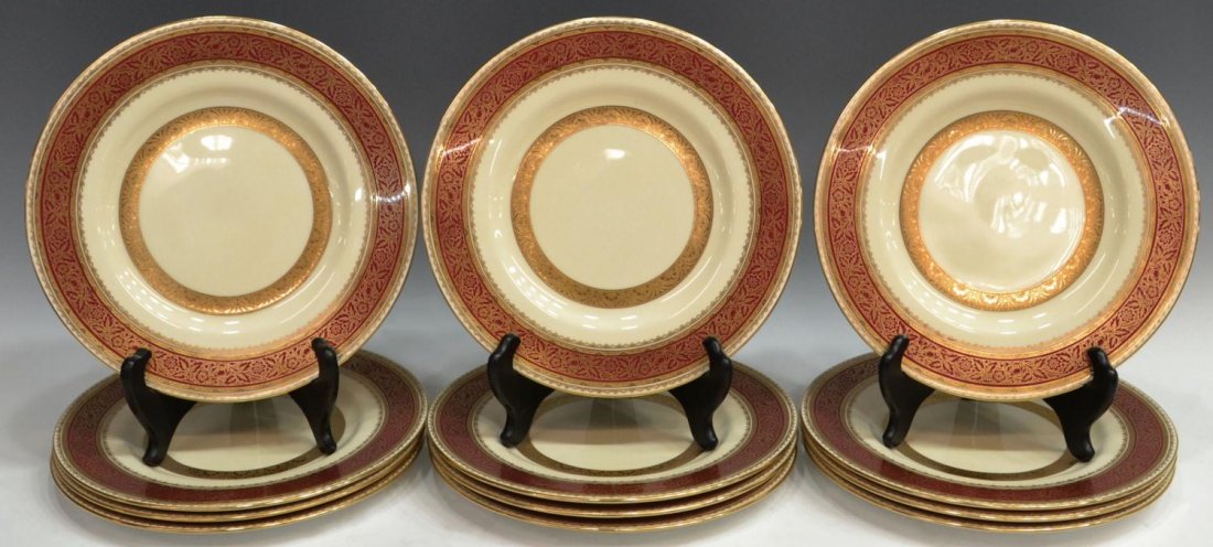 (12)MINTON'S HEAVILY GILDED & RED PORCELAIN PLATES: (set of 12) English porcelain dinner plates, Mintons for Ovington Bros. of New York, early/mid 20th c., each having deep red borders heavily gilded with flowering foliates and shell motifs on a cream 