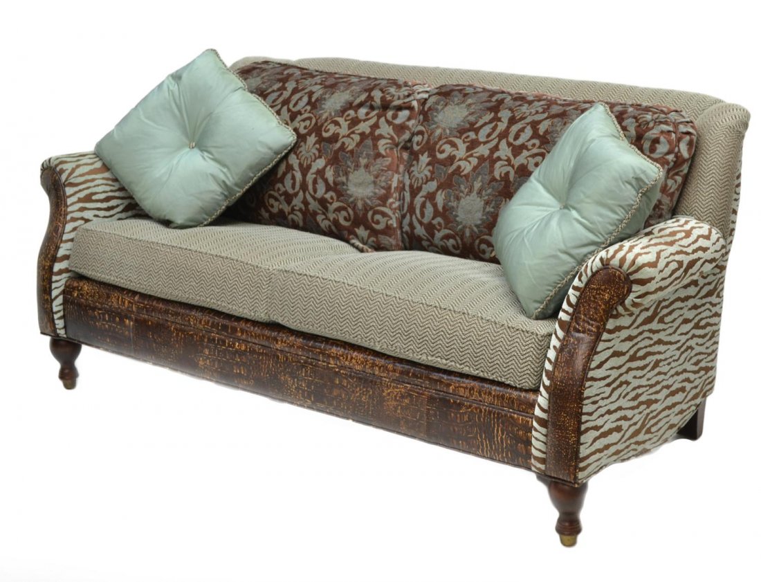 PARKER SOUTHERN FABRIC & LEATHER SOFA: Sofa by Parker Southern Company, North Carolina, a collage of fabric and leather including zebra print, foliate back pillows, two loose pillows, set on turned legs, 33.5"h, 72"w, 32"d **Provenance: Lo