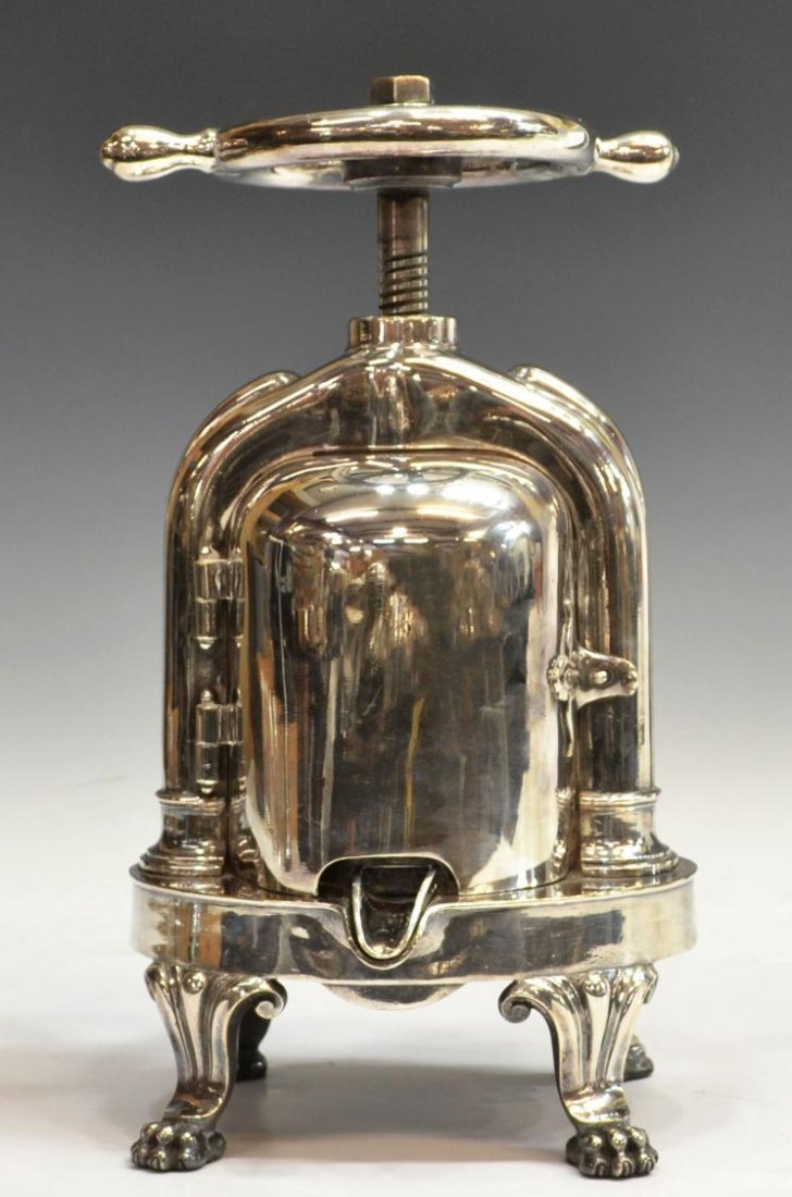 EARLY 20TH C. CHRISTOFLE SILVER PLATE DUCK PRESS: Christofle silver plate duck press, late 19th /early 20th c., of typical form, flat disk driven by a turn screw with a wheel at the top, hinged front and back open to reveal a removable pot with strai