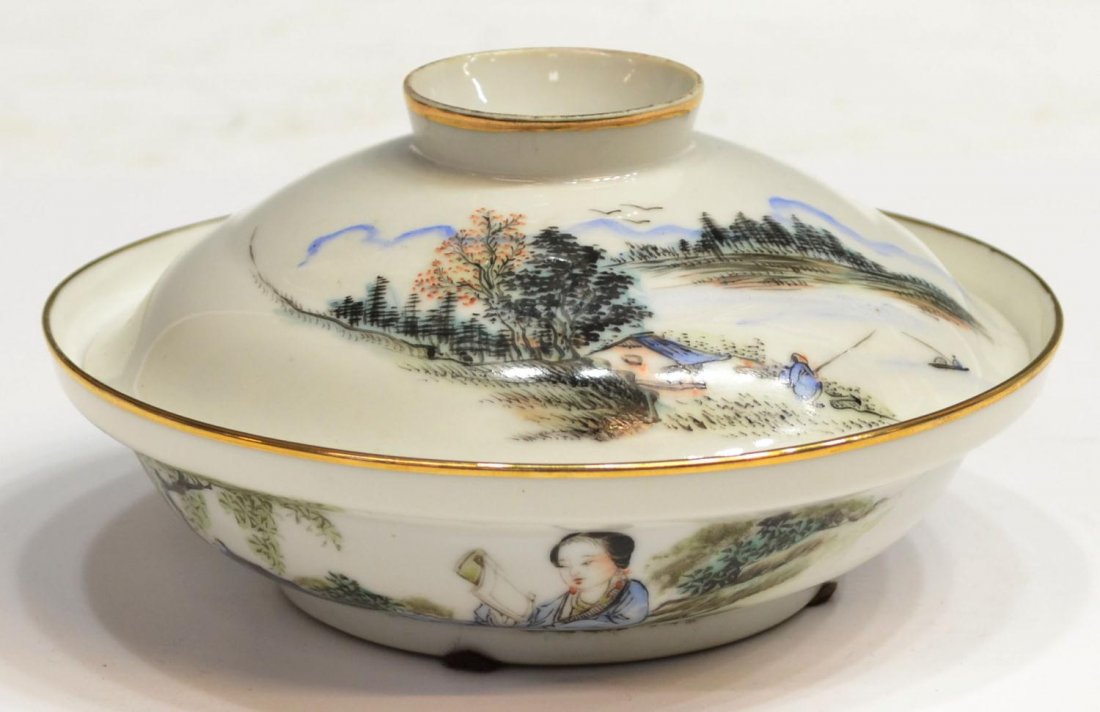 CHINESE FAMILLE ROSE EGG-SHELL PORCELAIN CUP: Chinese famille rose egg-shell porcelain bowl with cover, 20th c., the lid showing a landscape scene and characters, the base decorated with a young woman reading, gilt trim, roughness at foot and top