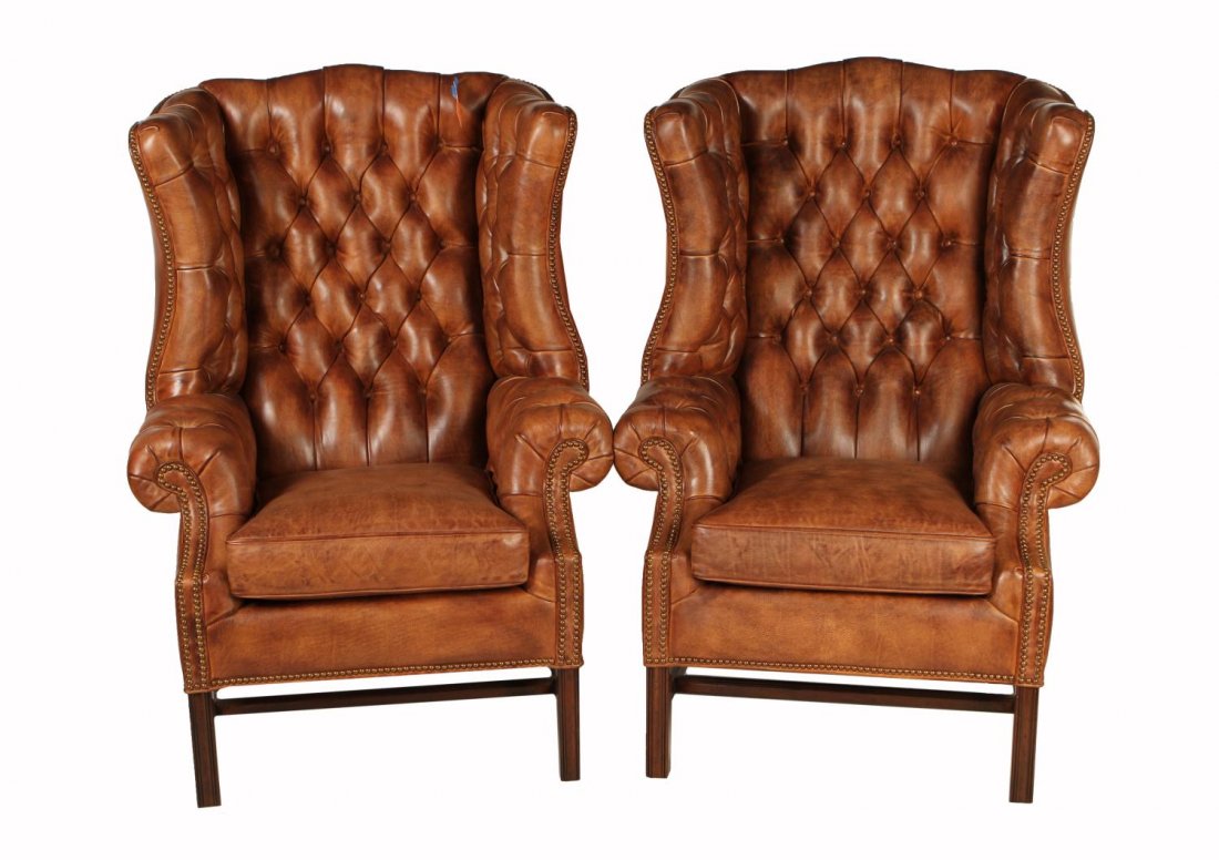 (2) NEW BUTTONED LEATHER WINGBACK CHAIRS: (lot of 2) Summerfield leather wing back chairs, Hancock & Moore, North Carolina, each with buttoned saddle leather at back and arms, brass nail head trim, set on straight legs with stretchers, 50"h,