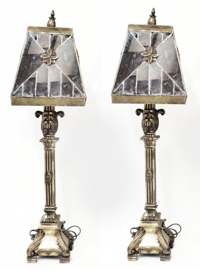 PAIR DECORATOR MIRRORED ANTIQUED TABLE LAMPS: (pair) Table lamps in an antique finish, each composition standard in the form of a candlestick surmounted by a mirrored shade with central floral element surrounded by a geometric pattern, 32.5"h, 14