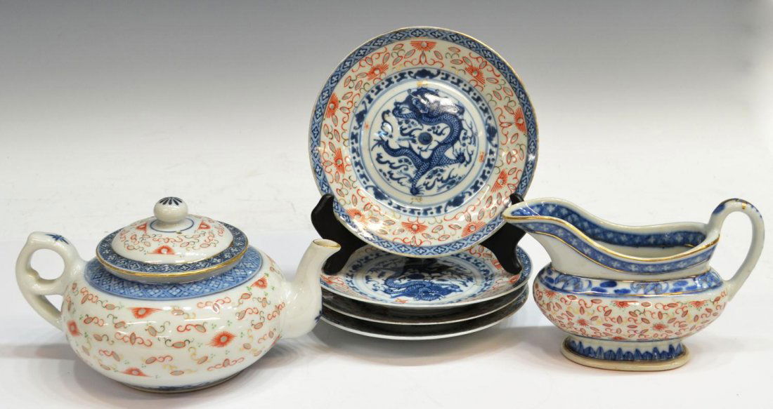 (6) CHINESE EXPORT PORCELAIN TABLEWARE: (lot of 6) Chinese export porcelain tableware set, in the rice pattern with blue, red and gilt detail, comprising: (1) teapot, 5"h; (1) creamer, 4.75"h; (4) plates, 19th, centered writing dragon, each