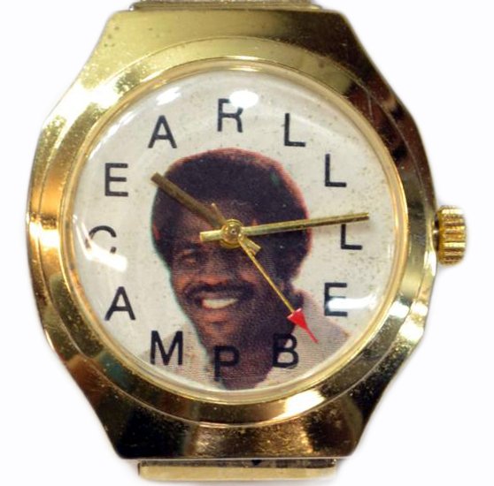 VINTAGE EARL CAMPBELL FOOTBALL WRISTWATCH: Vintage Earl Campbell wristwatch on an expandable band , the time markers spelling Earl Campbell, .25lb **Provenance: From the private collection of Coach Darrell K and Mrs. Edith Royal**Darrell K Roy
